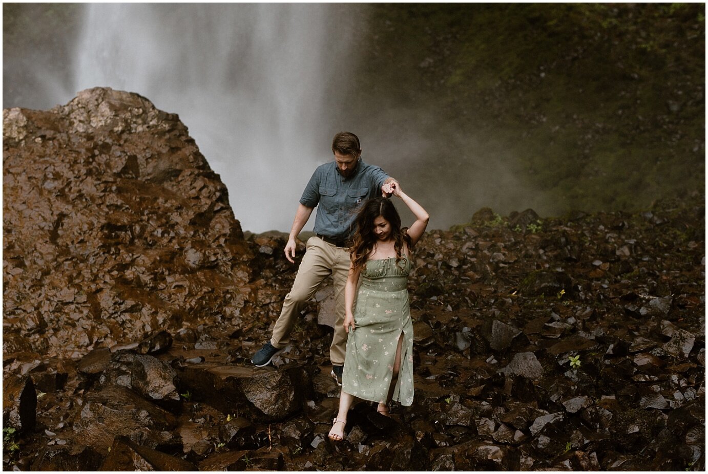 engaged couple posing in front of a waterfall in mt hood, oregon