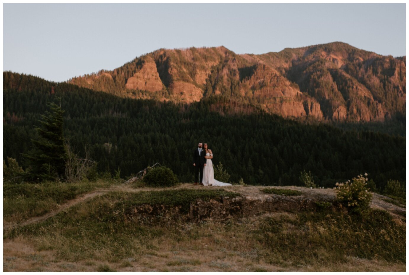 bride and groom taking sunset portraits during columbia river gorge elopement