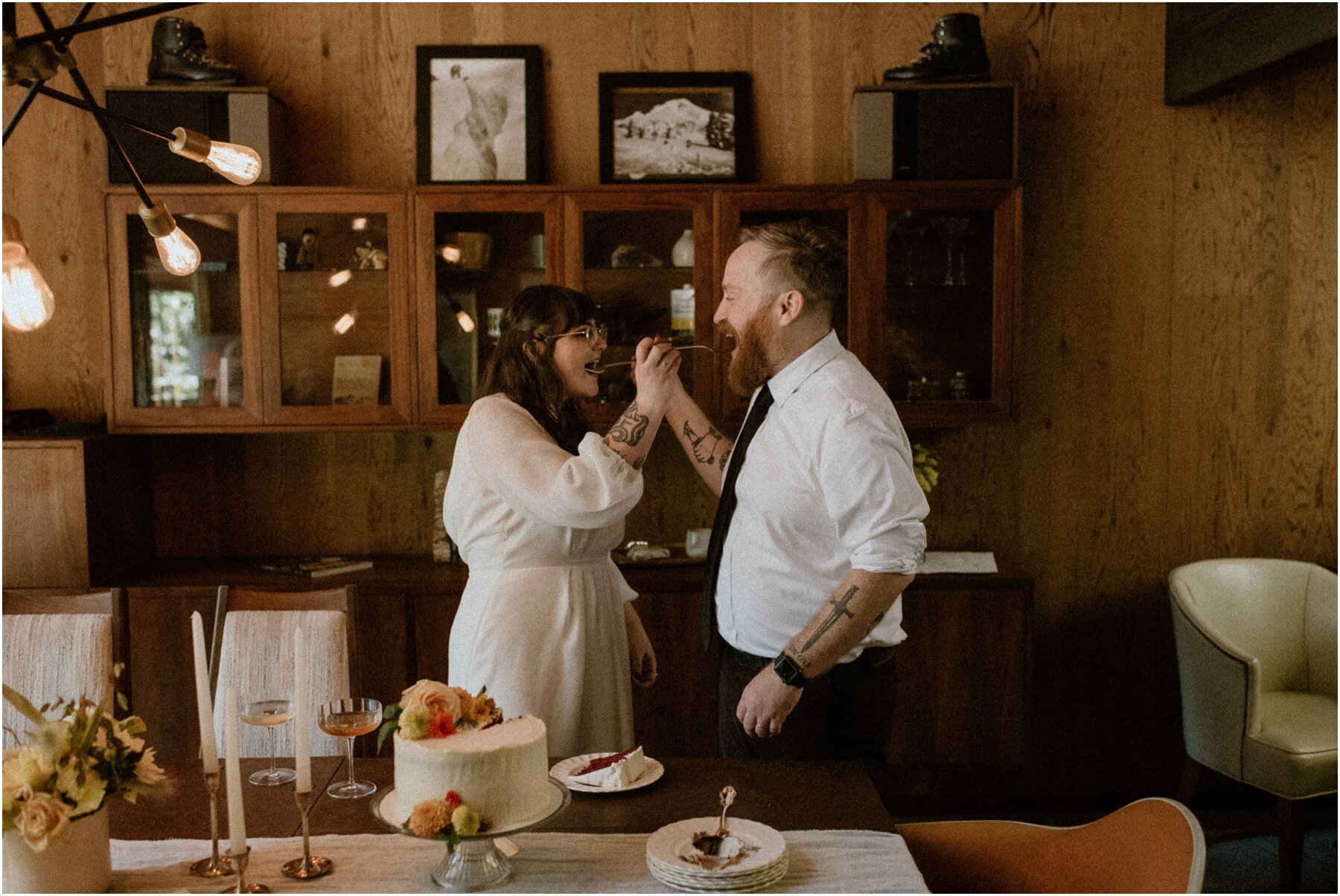 bride and groom cutting wedding cake after their woodsy elopement in Oregon