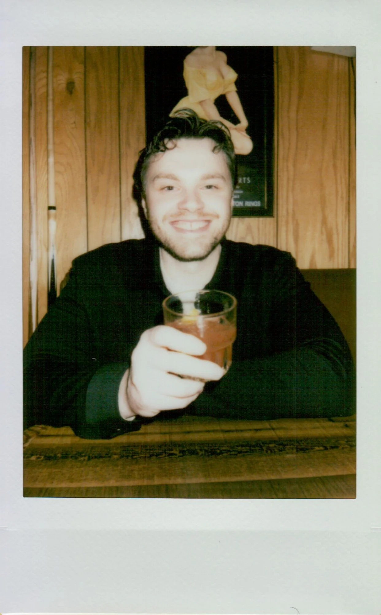  Polaroid photo of Rachel and Dakota during their Portland engagement session, candid and nostalgic moment, shot on Polaroid 