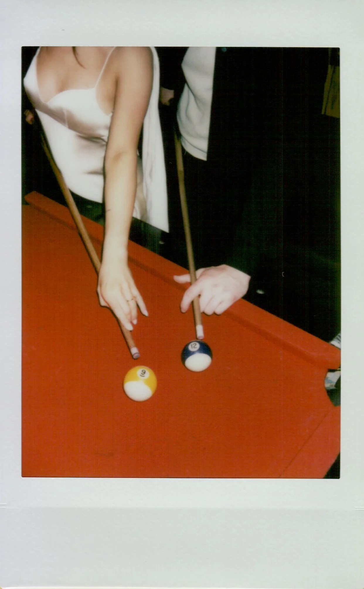  Polaroid photo of Rachel and Dakota during their Portland engagement session, candid and nostalgic moment, shot on Polaroid 