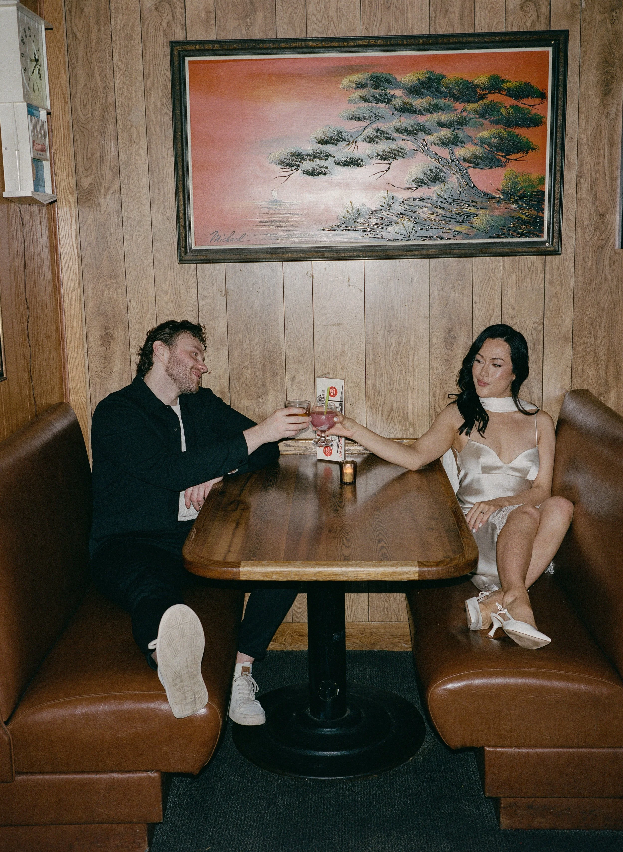  Intimate flash portrait of Rachel and Dakota inside The Sandy Hut dive bar, cozy and nostalgic Portland engagement photos, shot on 