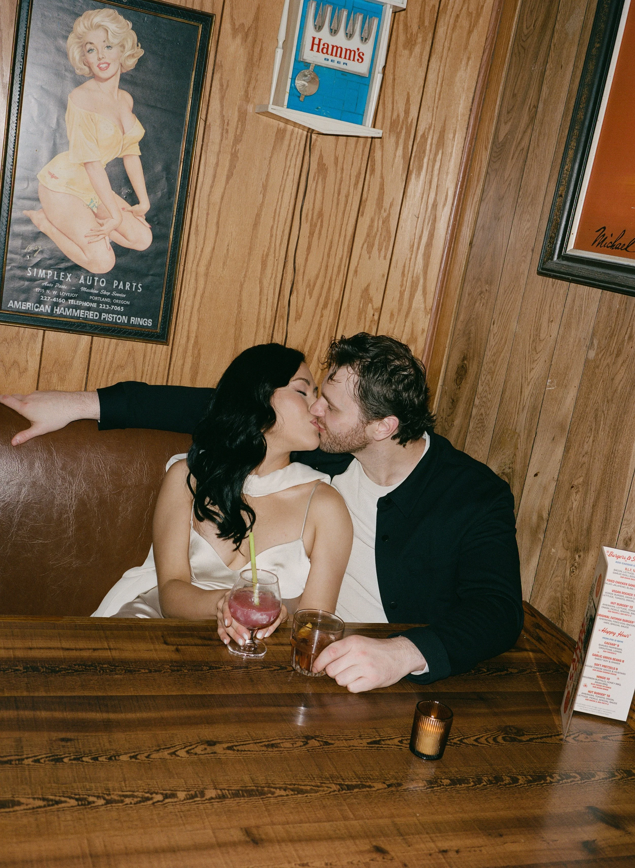  Intimate flash portrait of Rachel and Dakota inside The Sandy Hut dive bar, cozy and nostalgic Portland engagement photos, shot on 