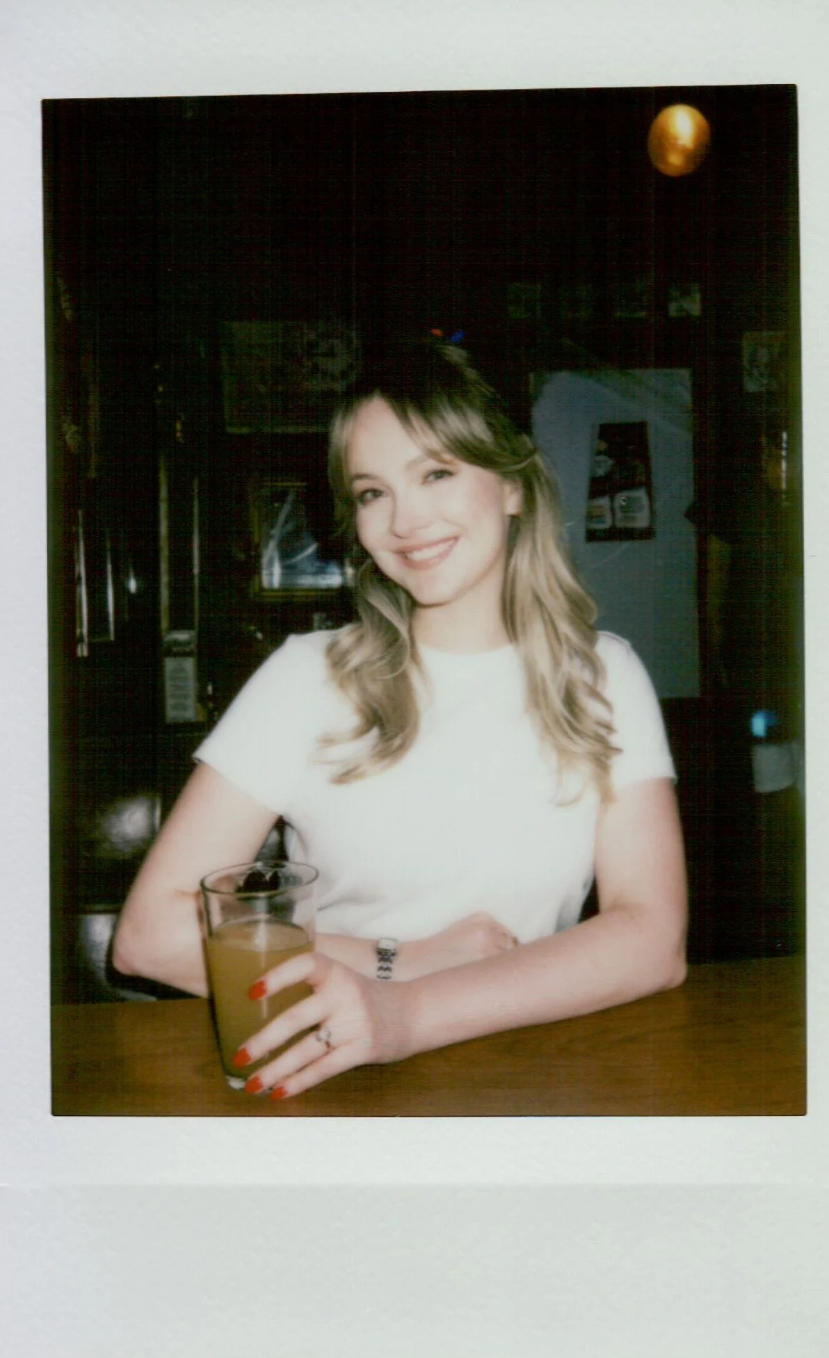  polaroid of couple during engagement session in Portland Oregon, soft tones and instant film texture 