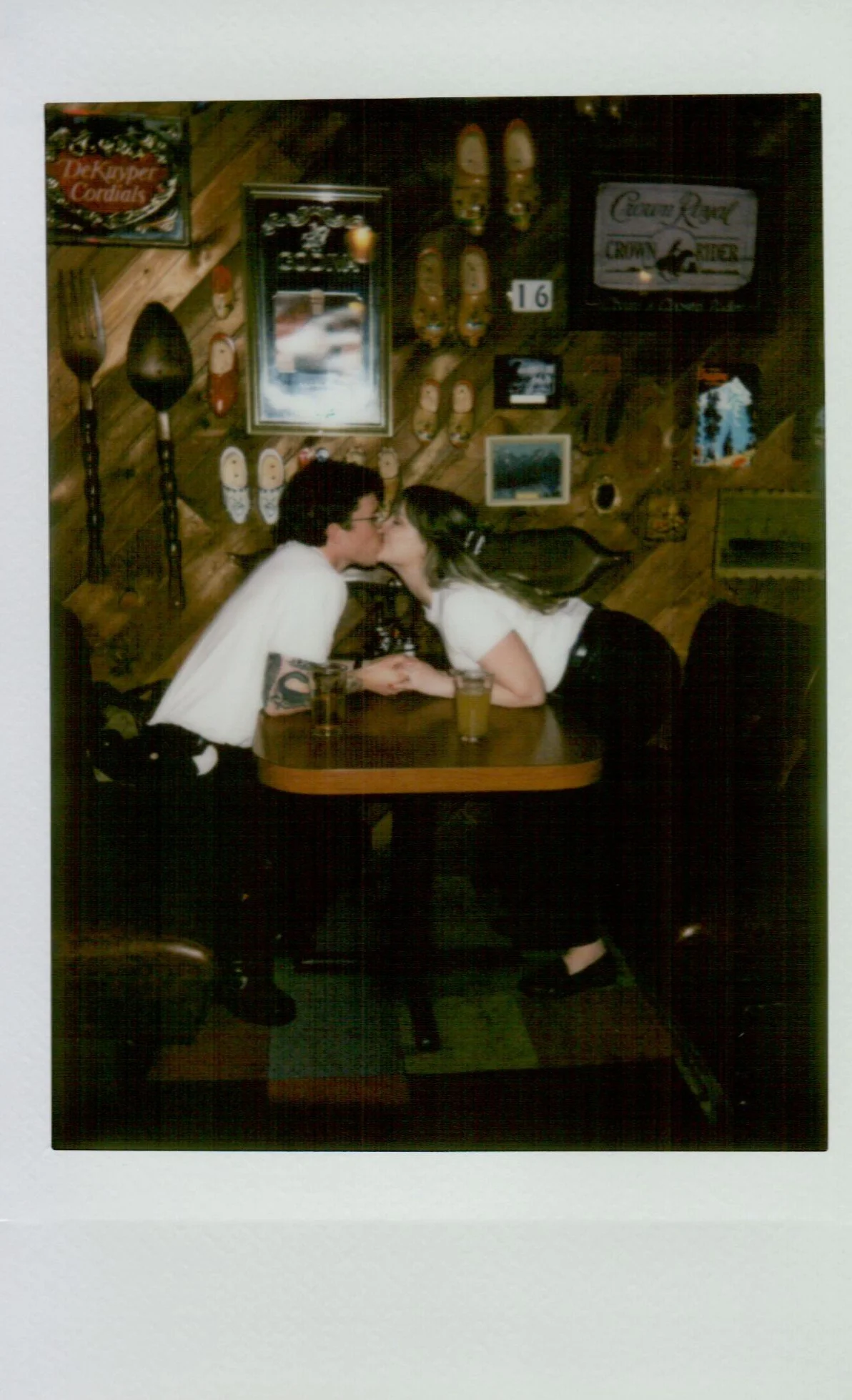  polaroid of couple during engagement session in Portland Oregon, soft tones and instant film texture 