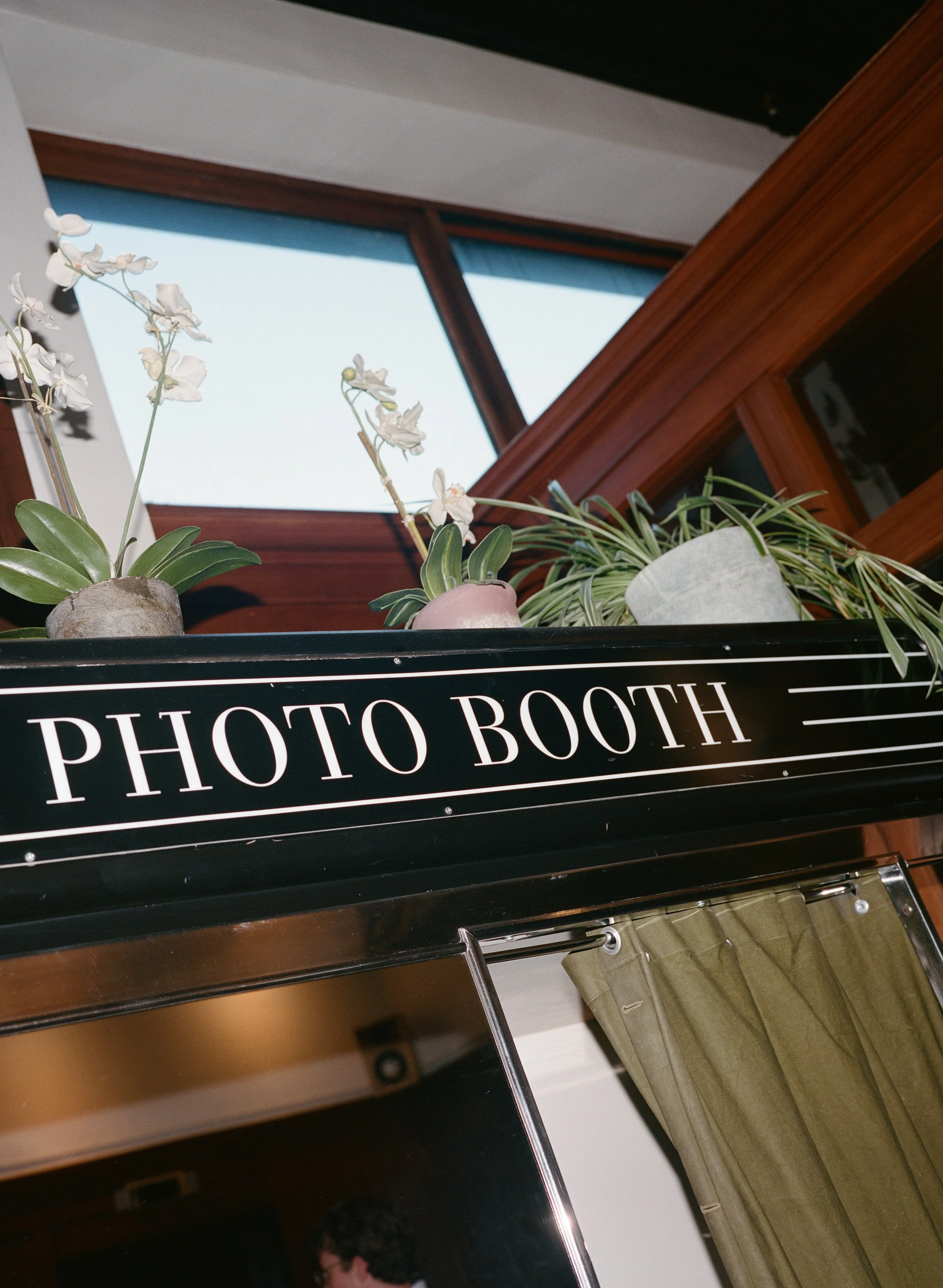  playful engagement photos inside downtown Portland hotel photo booth with flash, candid movement and imperfect frames, film-inspired 