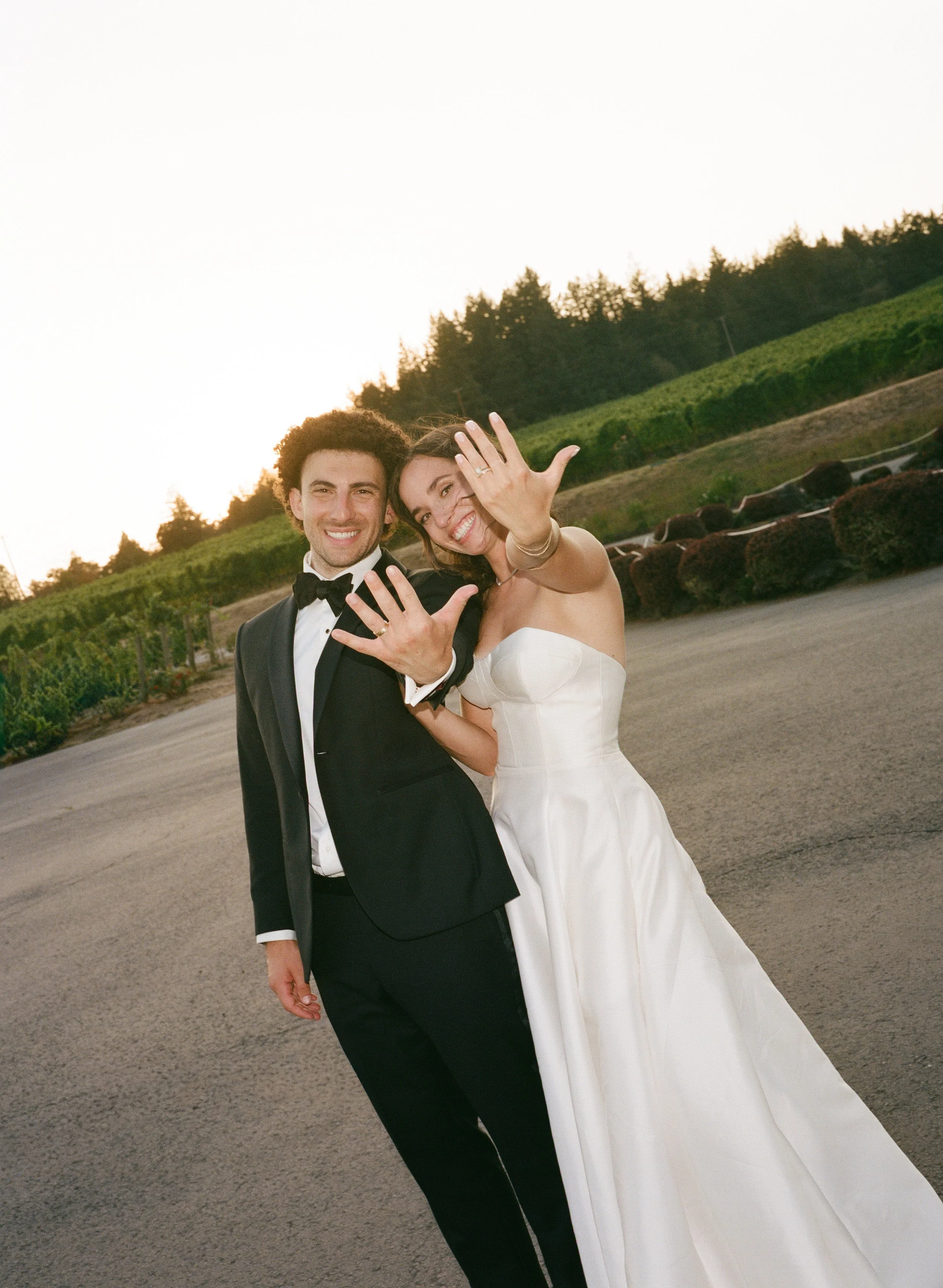  35mm film photo of romantic golden hour wedding portraits with soft light and natural movement 