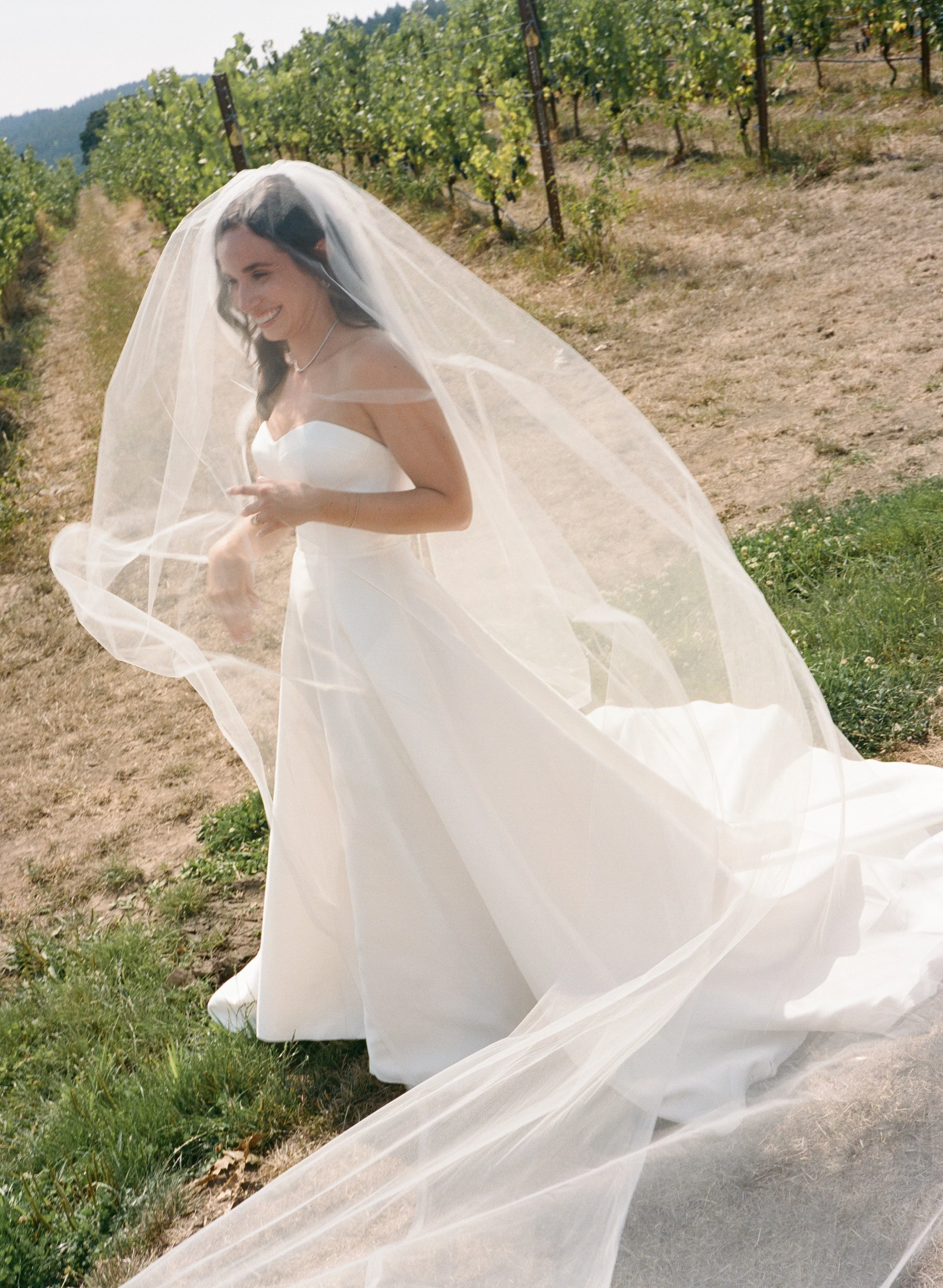  35mm film photo of romantic golden hour wedding bridal portraits with soft light and natural movement 