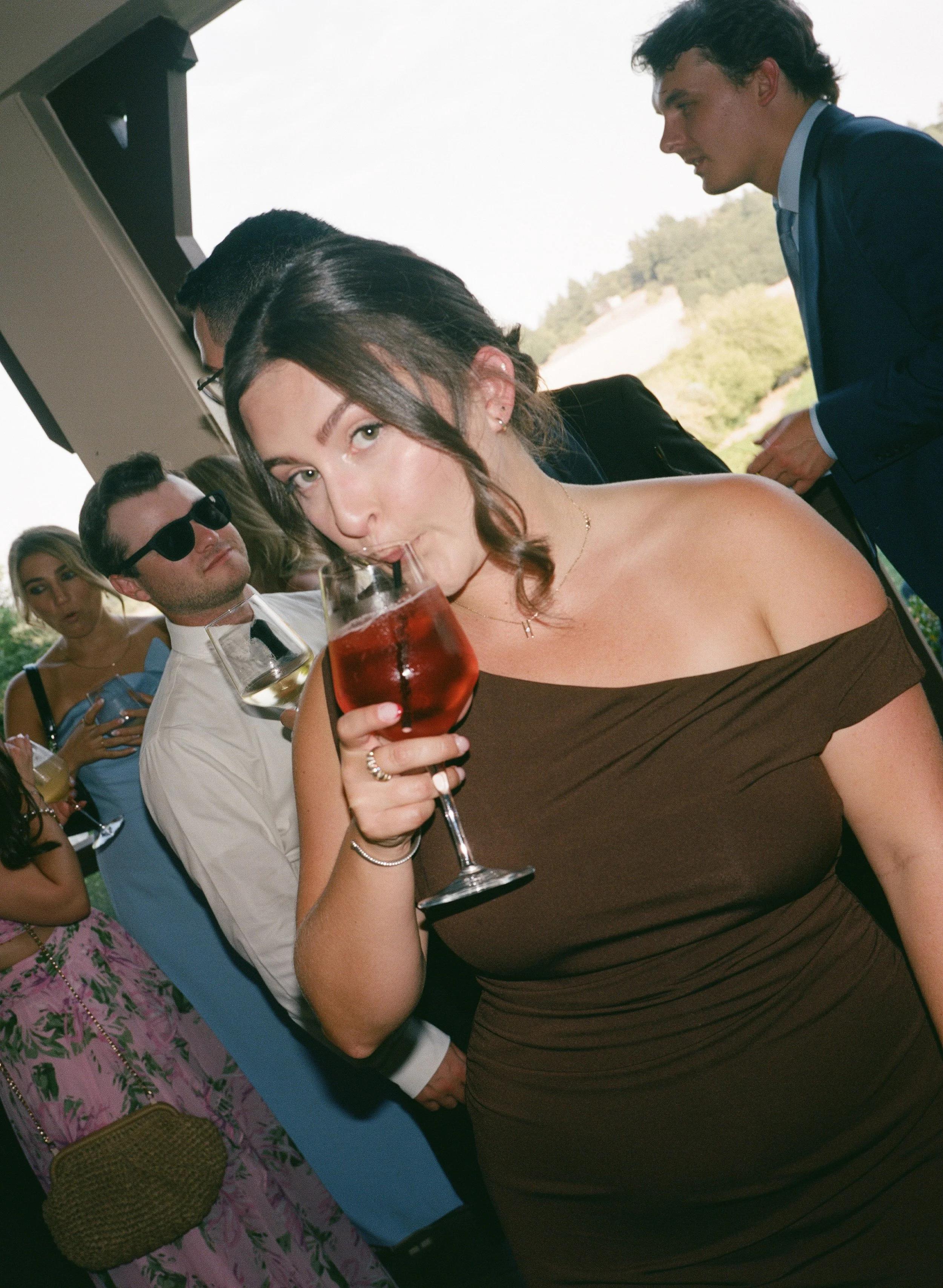  Medium format film photo of guests enjoying wine and conversation at Zenith Vineyards 