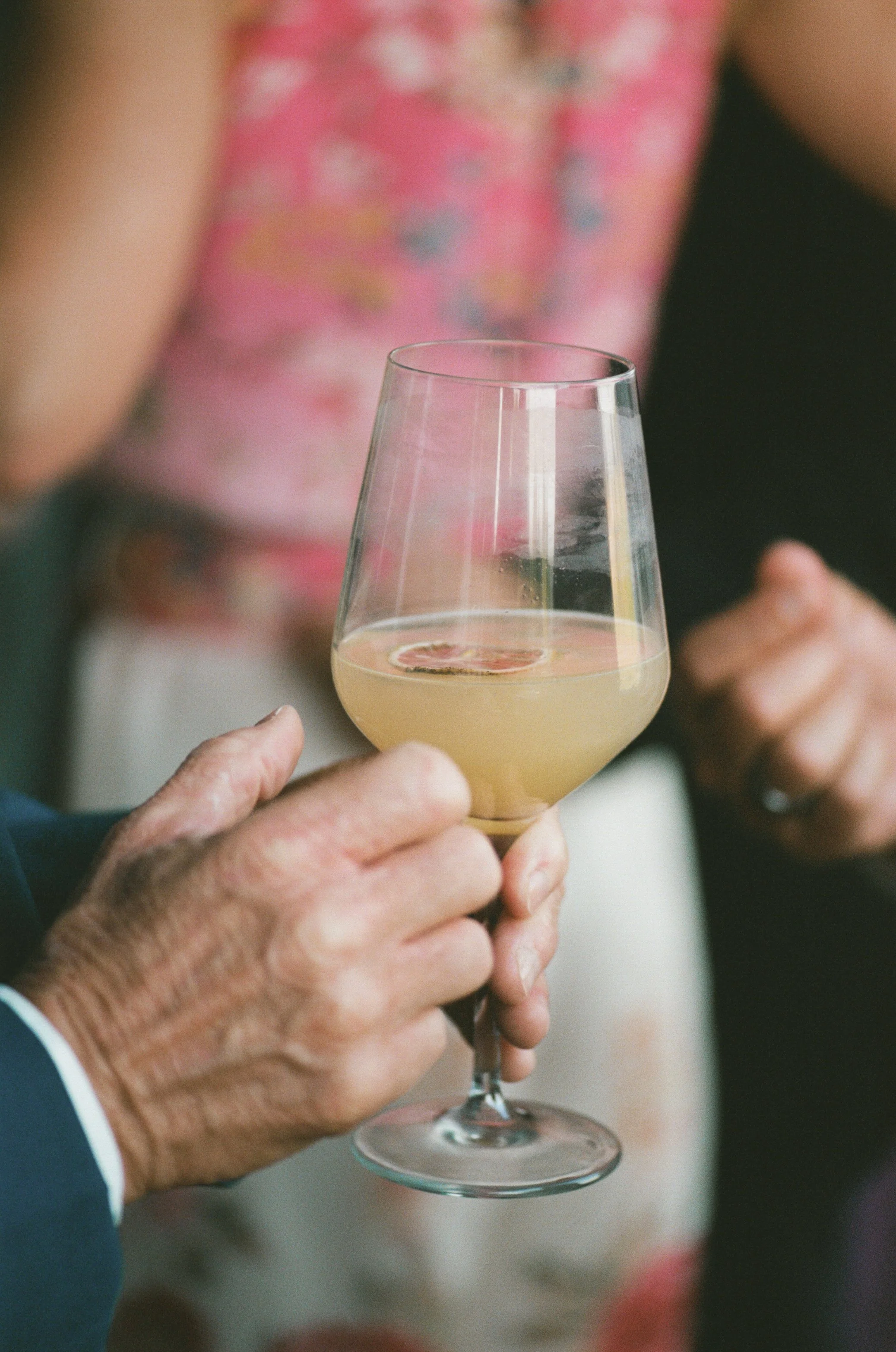  Medium format film photo of guests enjoying wine and conversation at Zenith Vineyards 