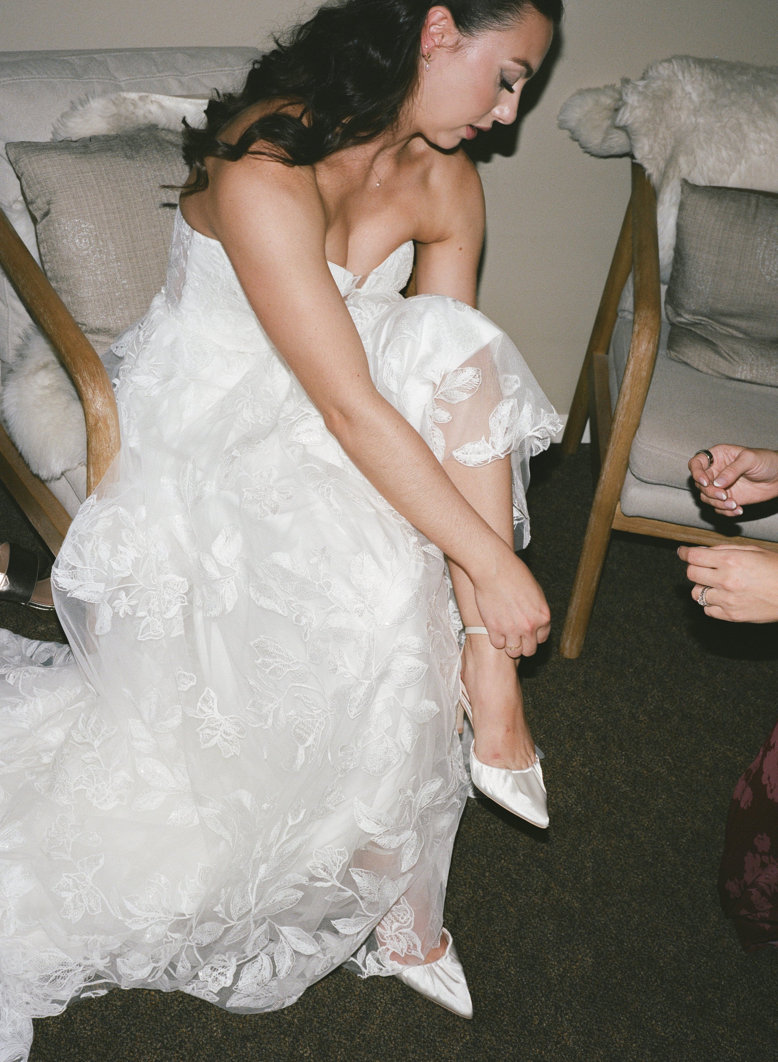  Garden-inspired wedding at JM Cellars featuring green and burgundy details, film photography, and an outdoor winery setting. Bridal getting ready moment captured on film. 