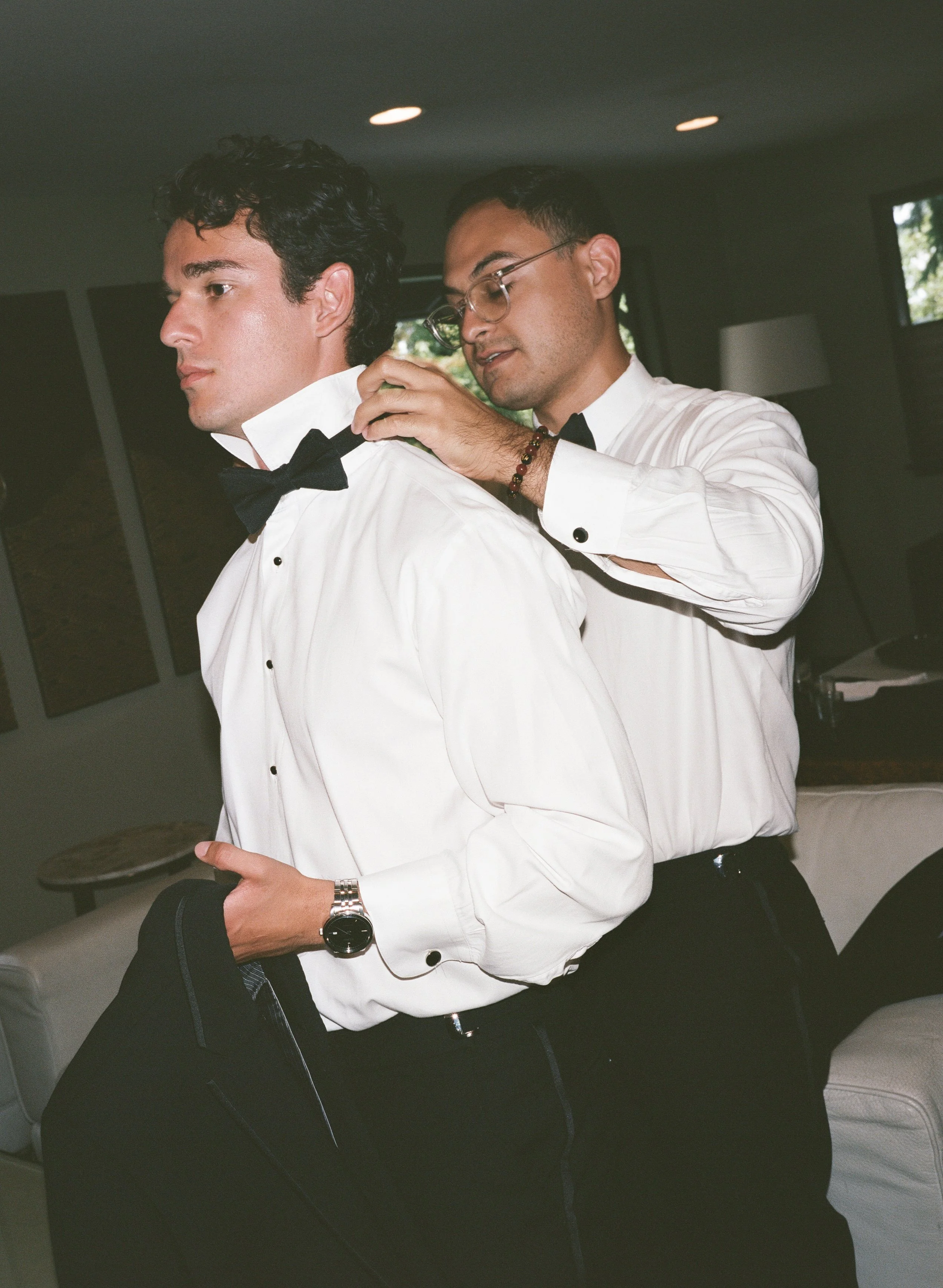  Garden-inspired wedding at JM Cellars featuring green and burgundy details, film photography, and an outdoor winery setting. Groom getting ready film flash wedding photos. 