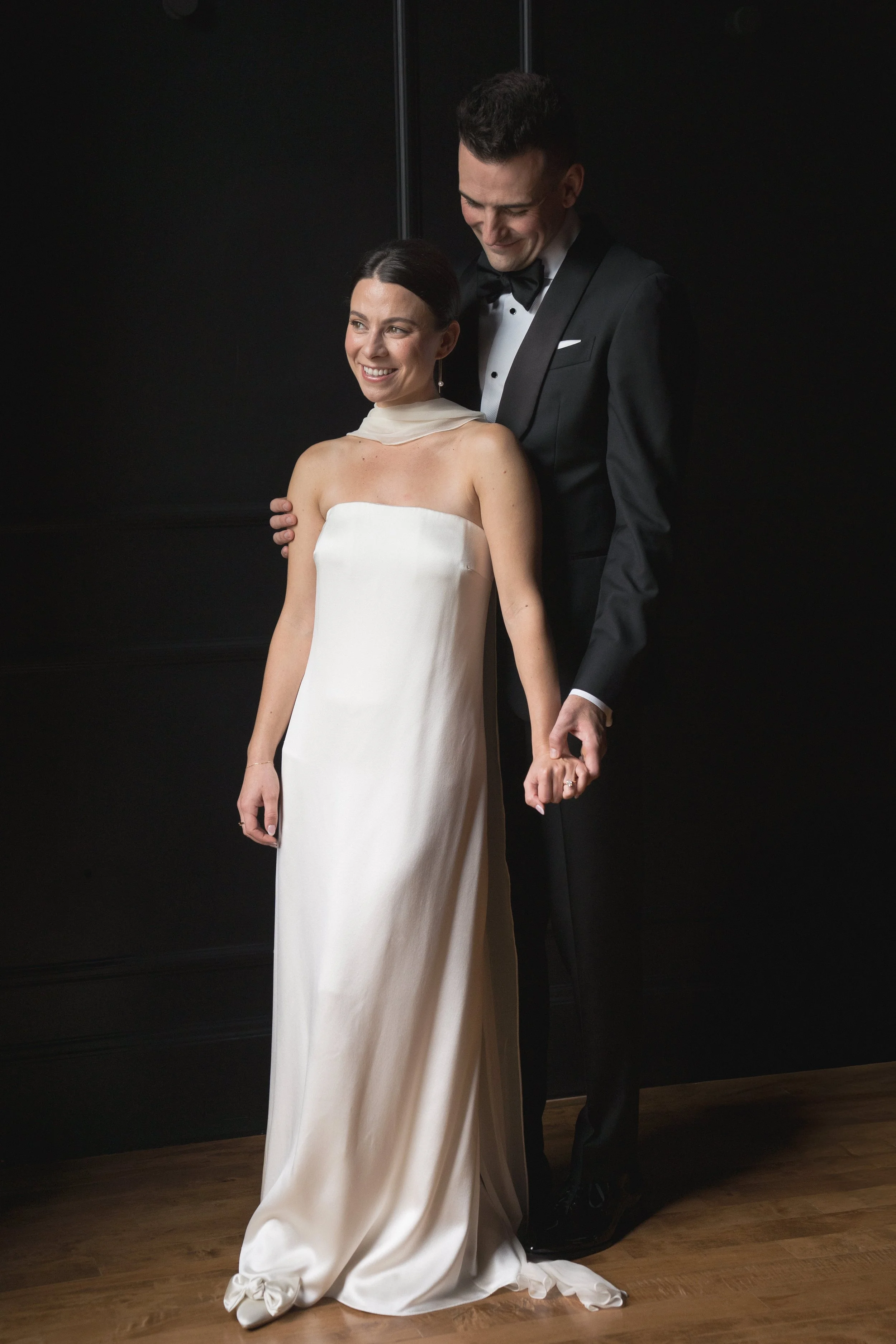 Stylish bride in a silk sheath wedding dress with neck scarf at The Arc Light