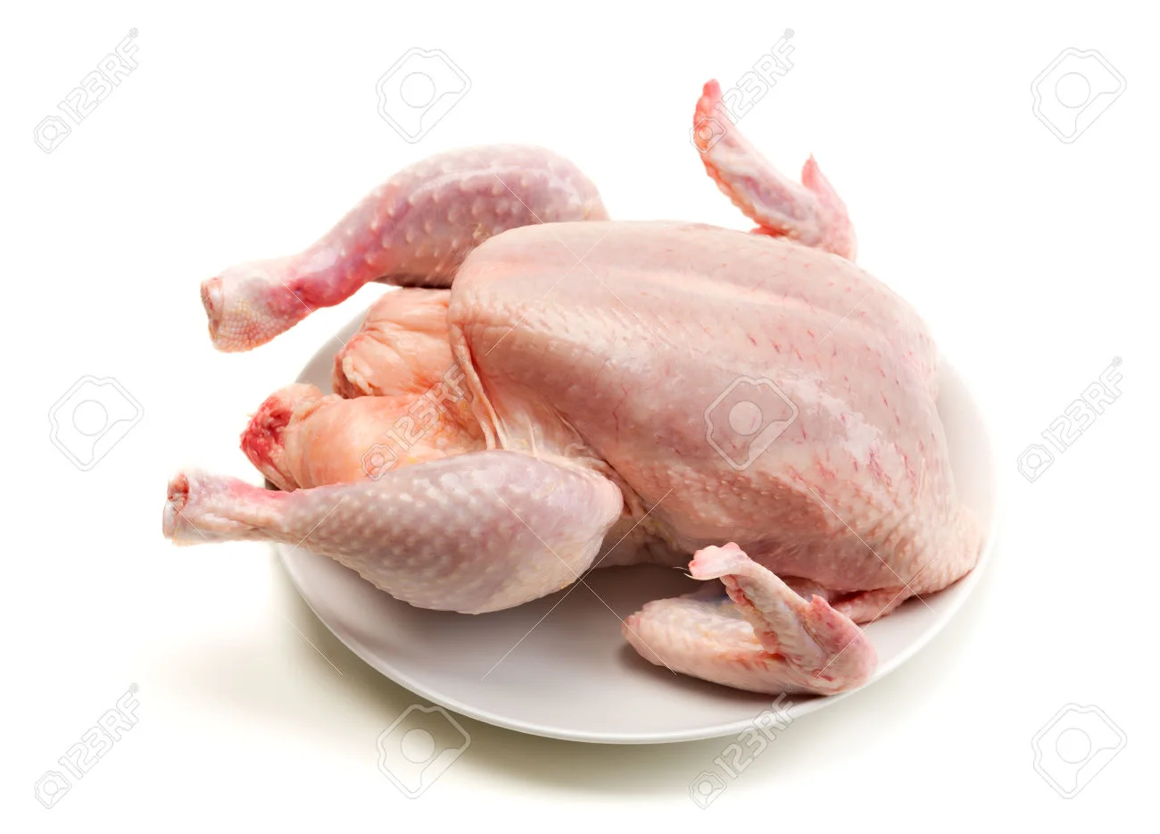 35307738-Carcass-of-broiler-chicken-on-a-plate-not-cooked-Isolate-on-white-background-Stock-Photo.jpg