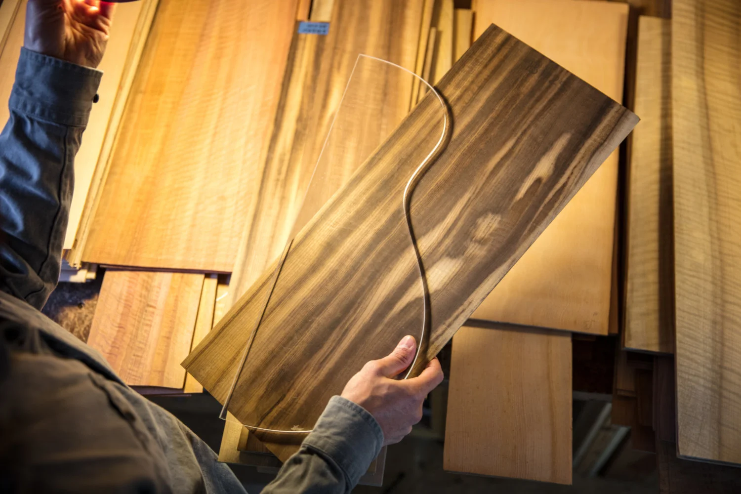 Luthier Mark Gaiero of Gaiero Guitars sorts through a stack of tonewood.