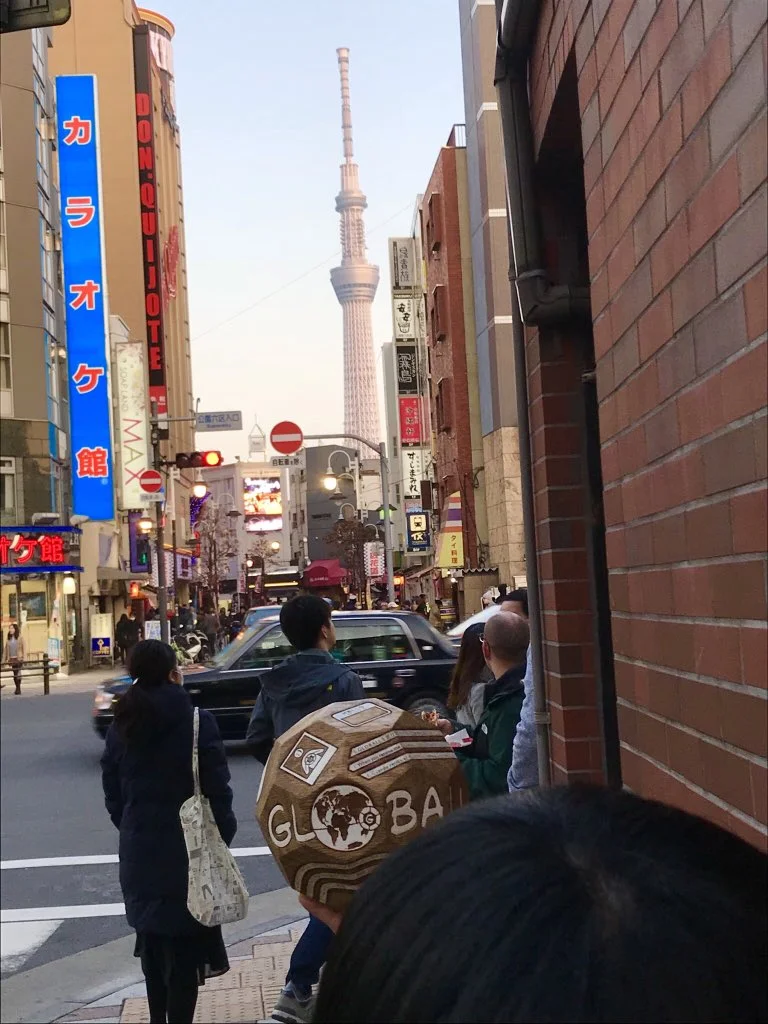 Seiko with GLOBALL Rover in the foreground and Tokyo Skytree in the background.