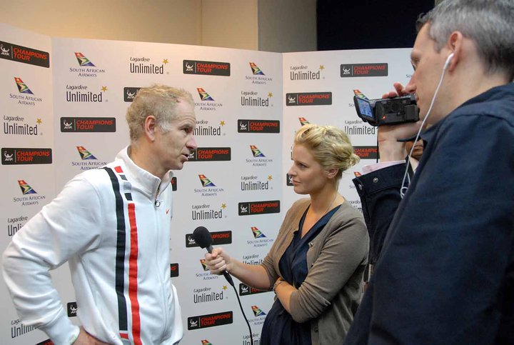 Catherine interviewing John McEnroe on the ATP Champions Tour.