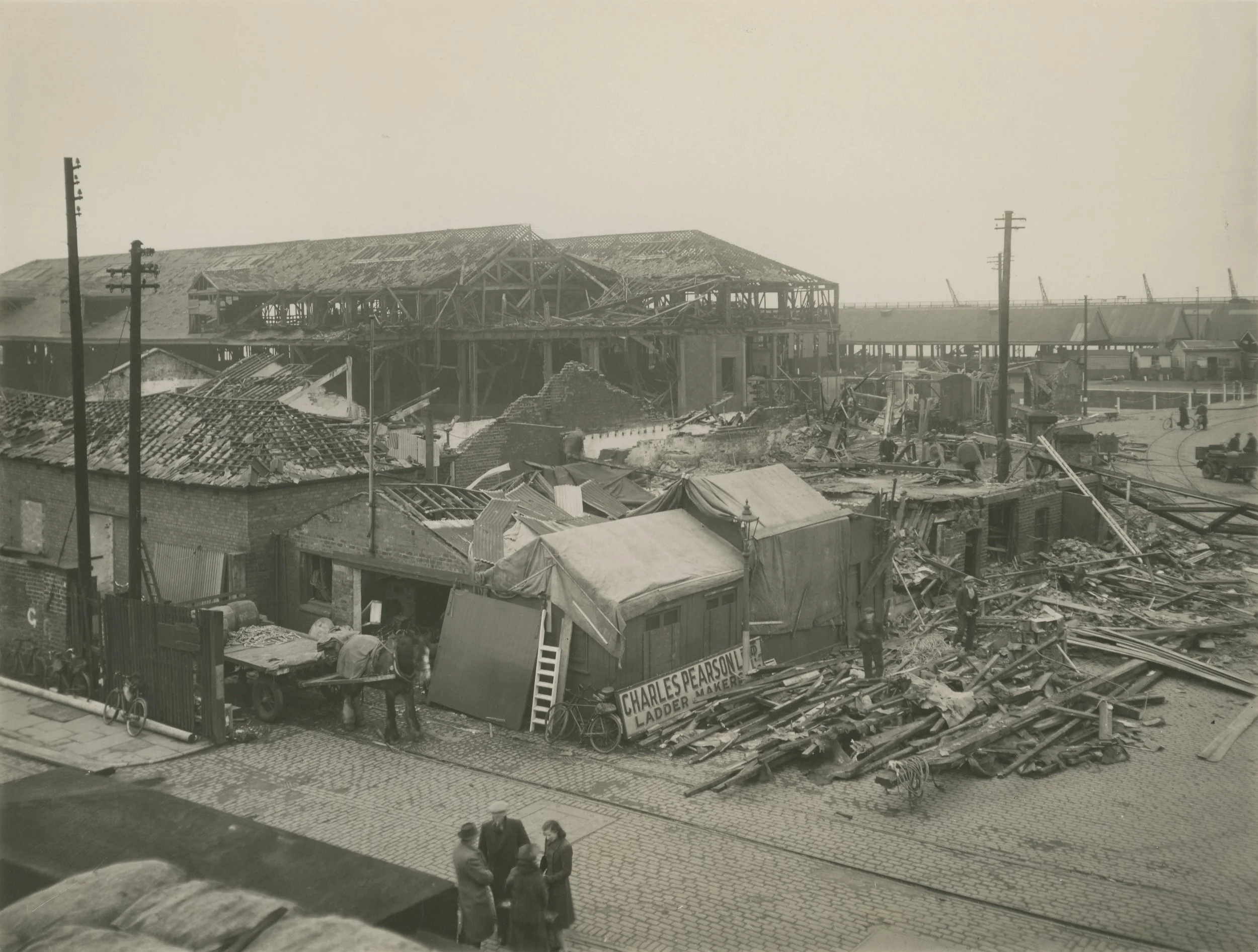 A view from Tower Bridge of damage caused by air raids. Albert Dock, Hull. 31st March, 1941. Photographer - unknown Commissioned by ABP.