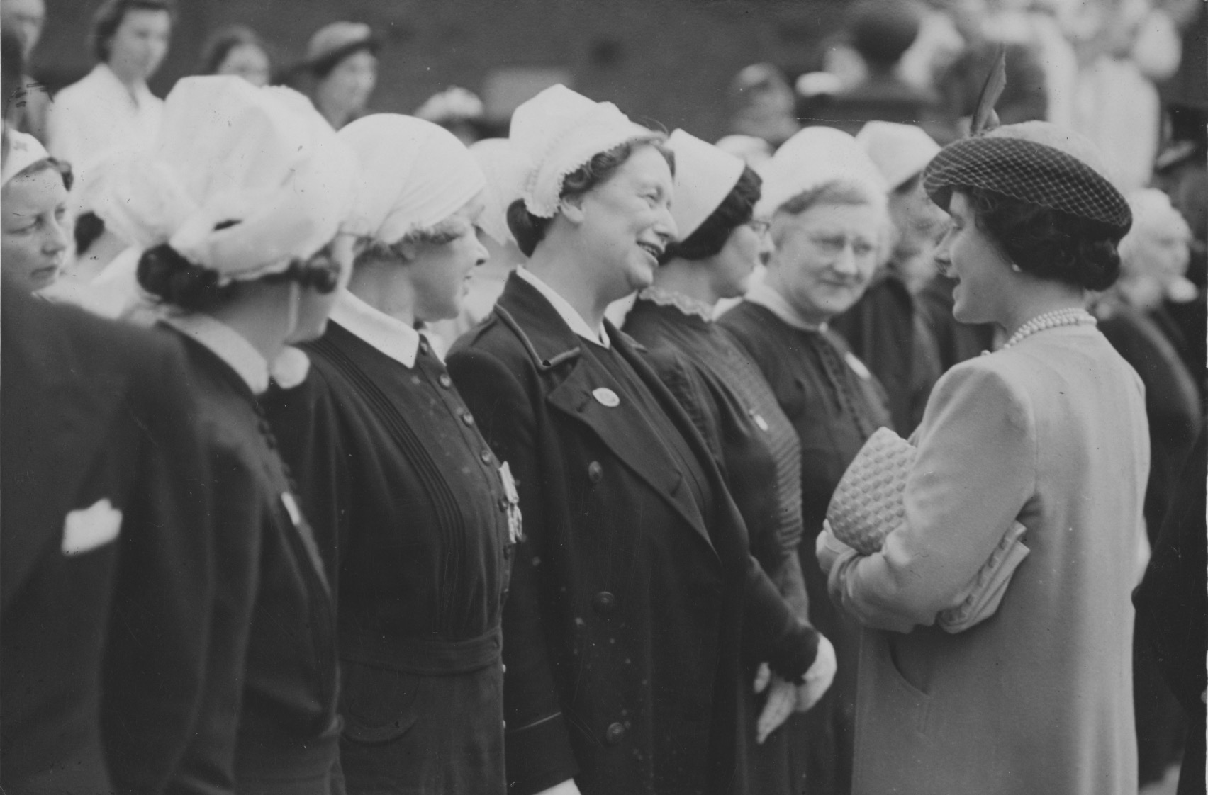 Chatting with Miss V. Coni (matron of hospital in Hull), 1940’s. Commissioned by Hull Daily Mail.