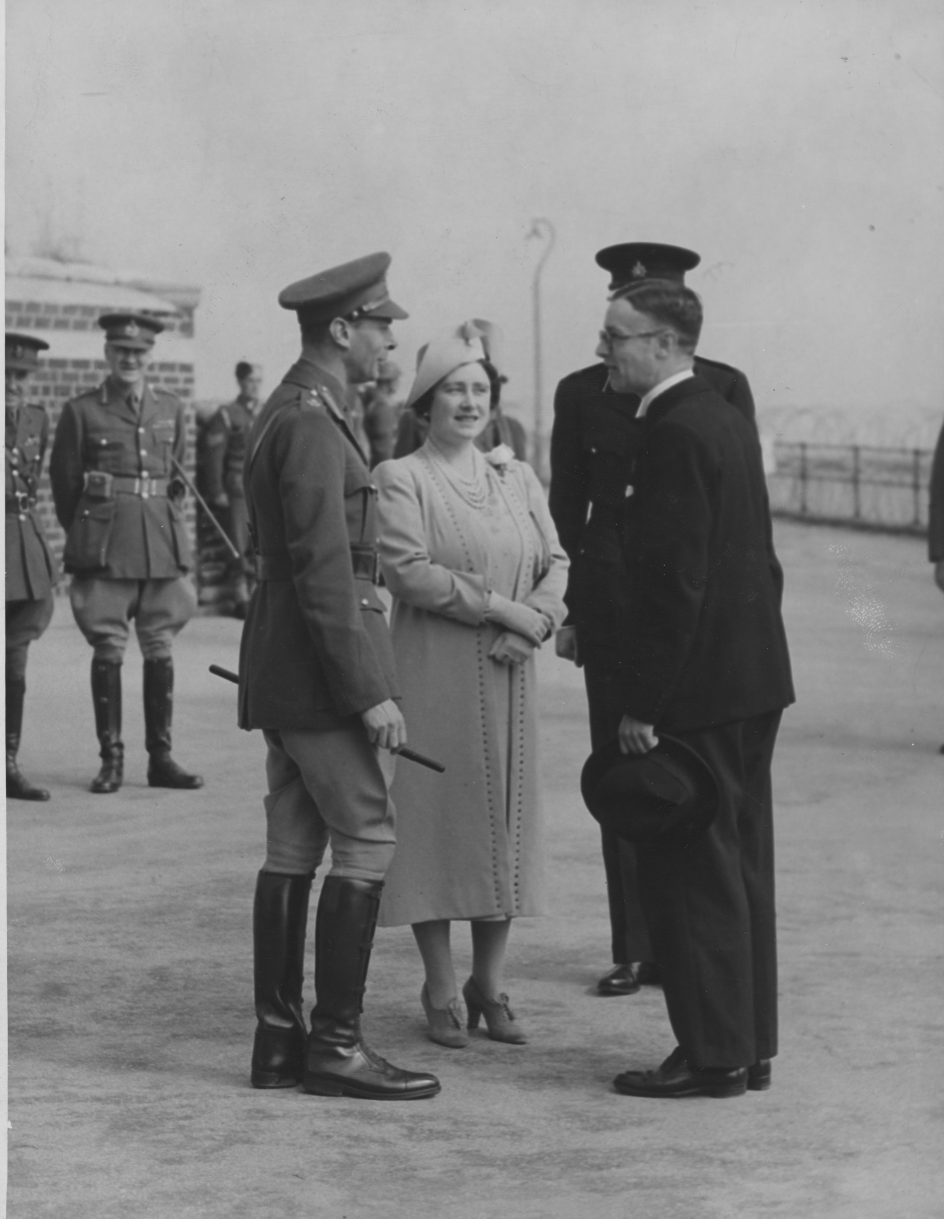 The King and Queen showed concern at the plight of sea-side boarding house keepers when they viewed the coastal defences of an East Coast resort . Here they are talking to Mr P. Shackles, chairman of the council, 1940’s. Commissioned by Hull Daily Mail.