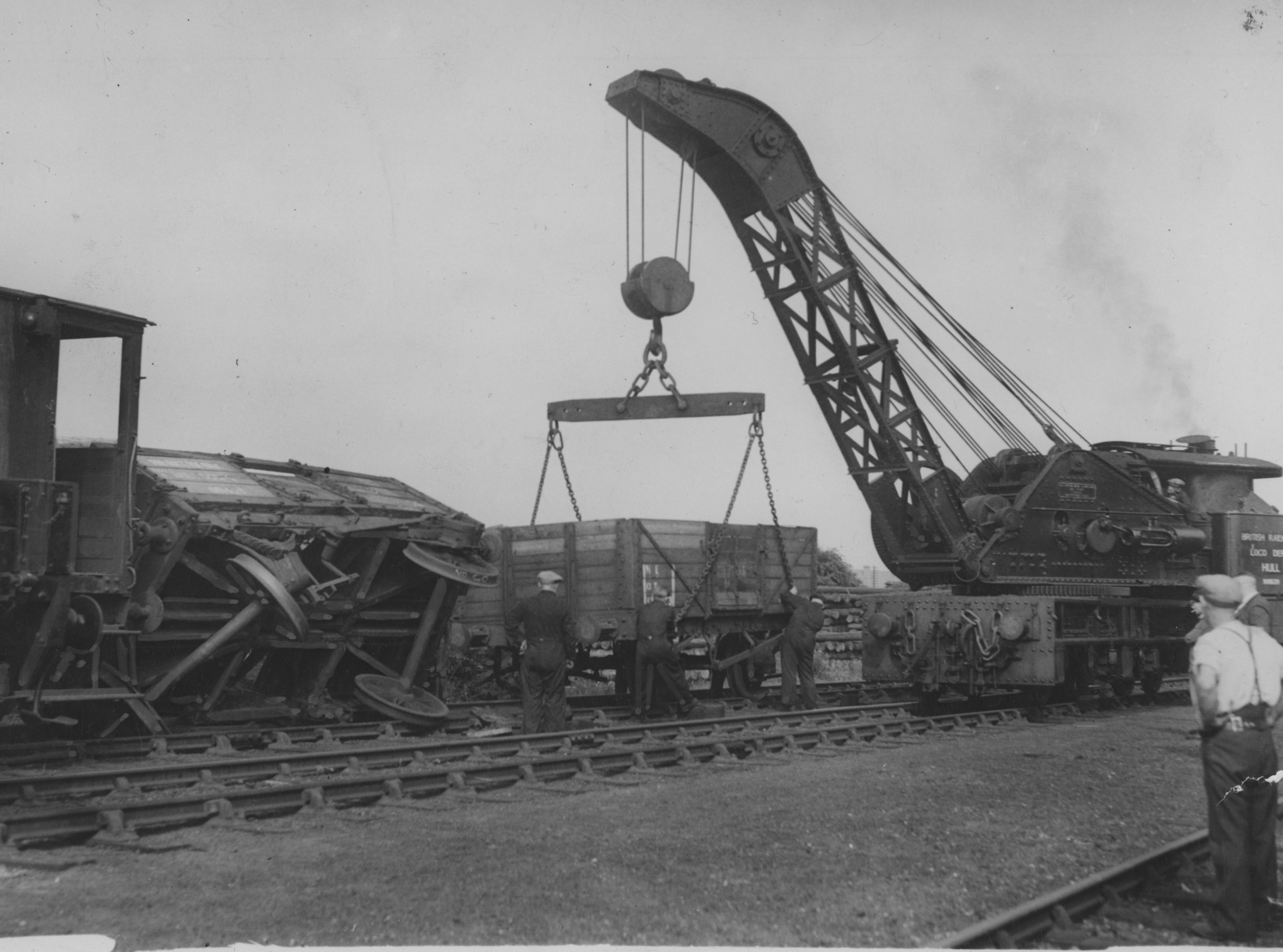 Wagon tears up track- railway breakdown crane at work righting a wagon which became derailed in a train of 60 on the main goods line between Outer Drypool and King George Dock. Commissioned by Hull Daily Mail.