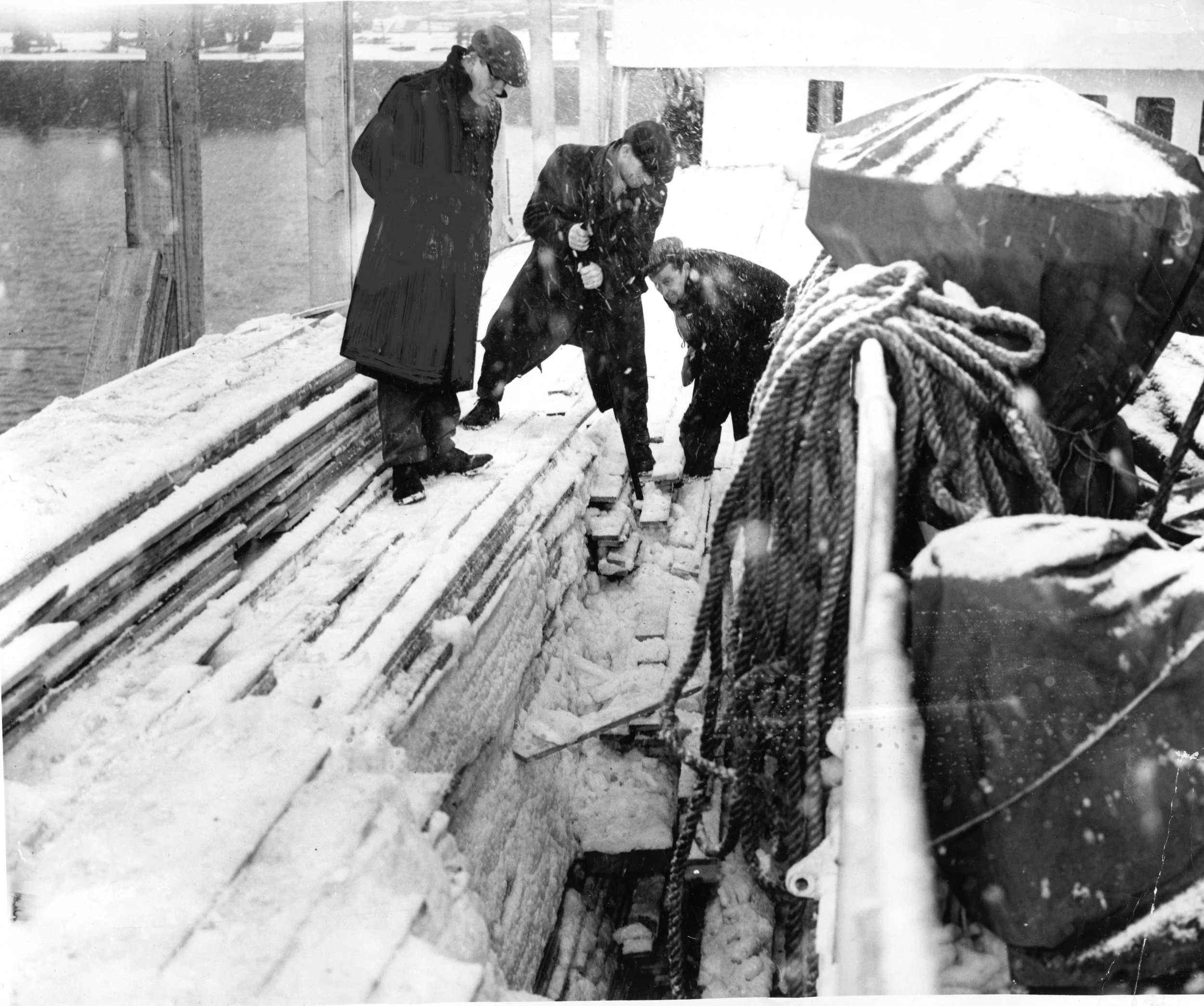 ICED up cargo- Hull dockers working aboard the Russian timber ship Belomorskies on Alexandra Dock today. Individual lengths of wood are frozen into one solid mass, 1960’s. Commissioned by Hull Daily Mail.