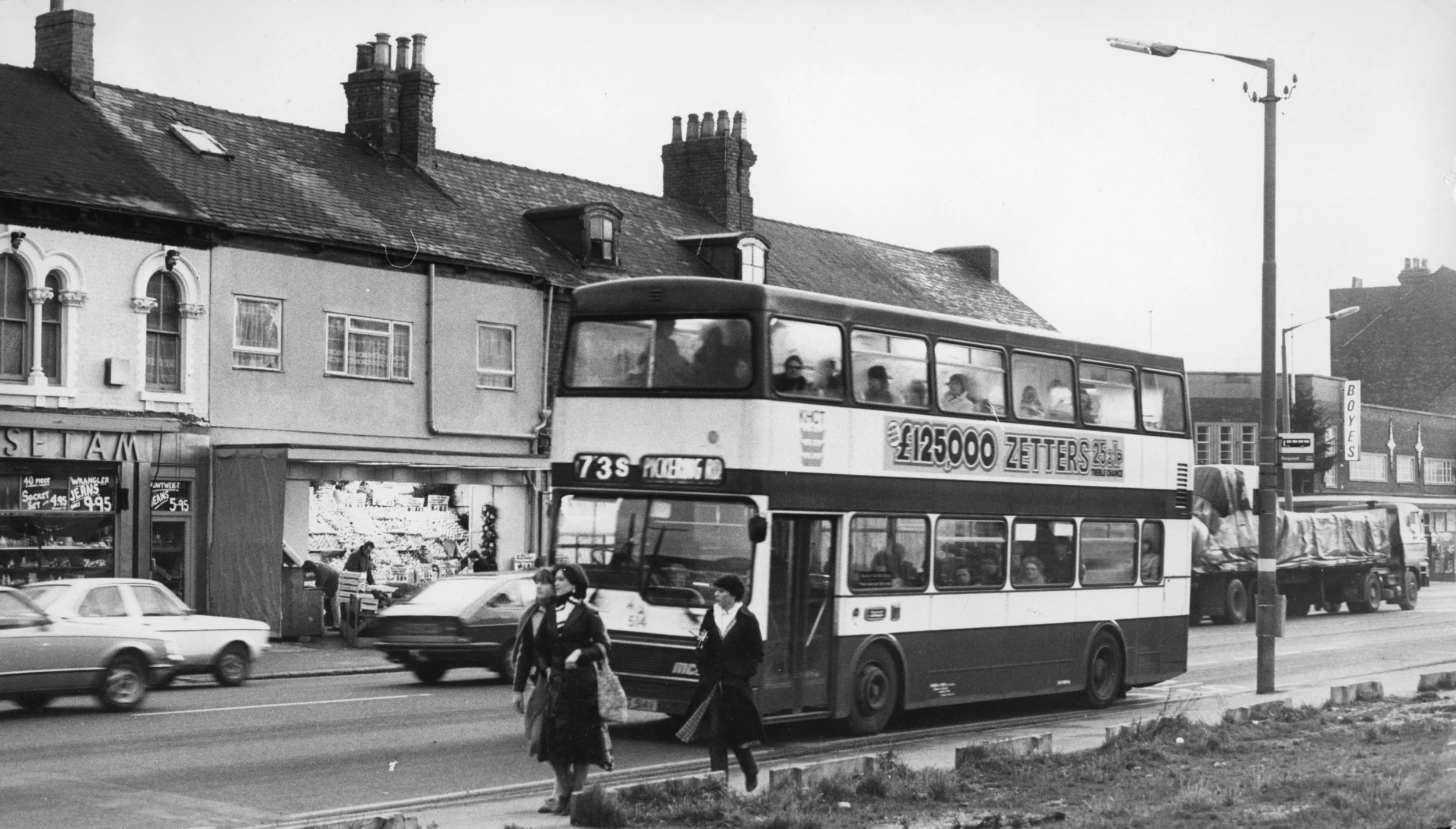 73S Bus on Hessle Road, between Setam's and Boyes. Pedestrians – one woman in a Hull FC scarf. Commissioned by Hull Daily Mail.