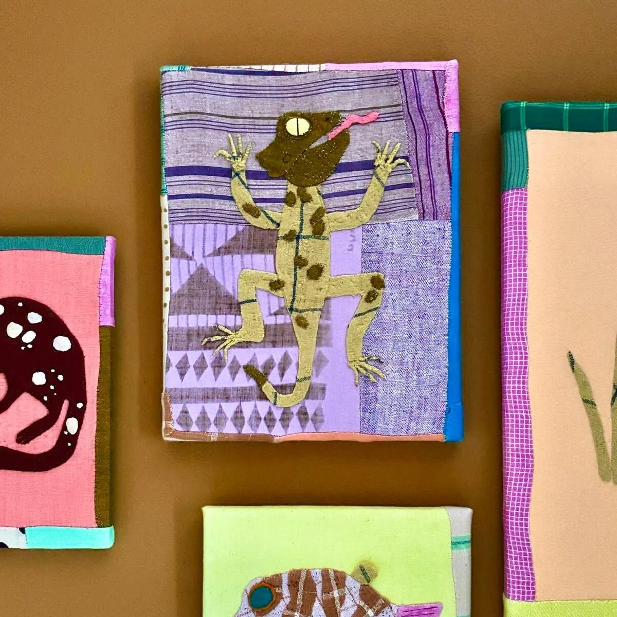 F O R  J U N I // A Bearded Dragon - the 3rd little appliqu&eacute; piece above her changing mat.