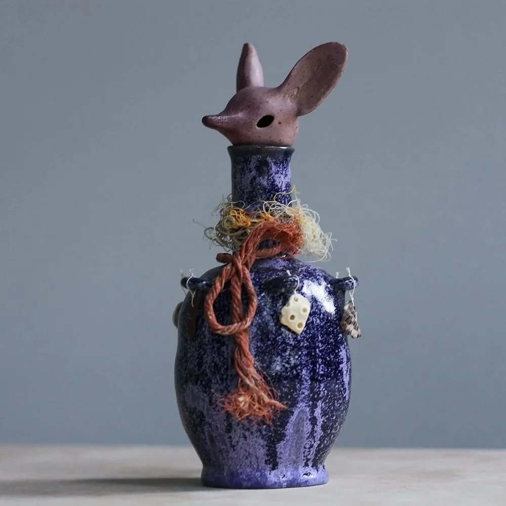 R I T U A L  V E S S E L S // *SOLD* - Elephant Shrew Canopic Jar.
Glazed stoneware adorned with found objects.
2024.