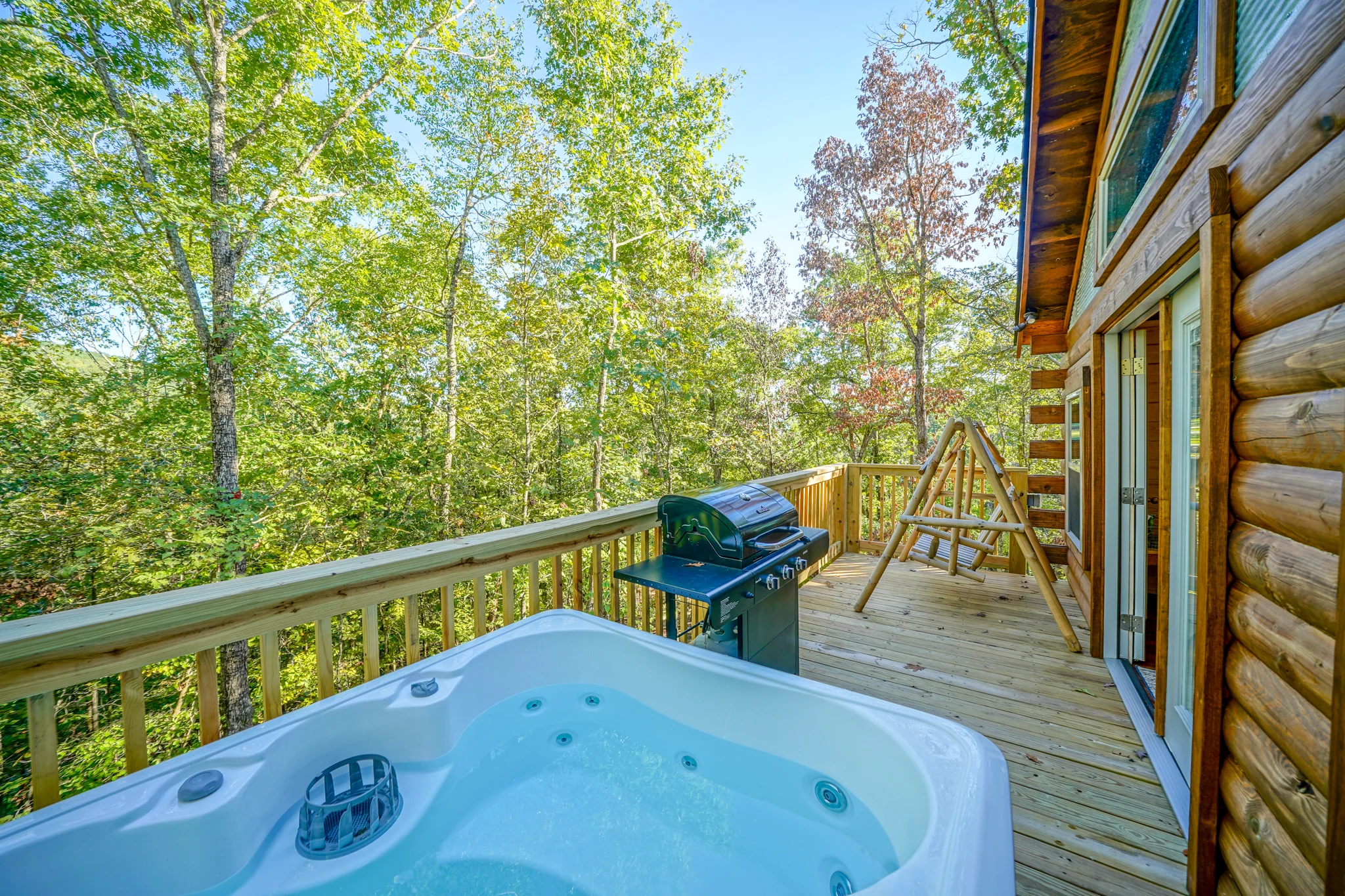 Your own private hot tub overlooking canopy of trees