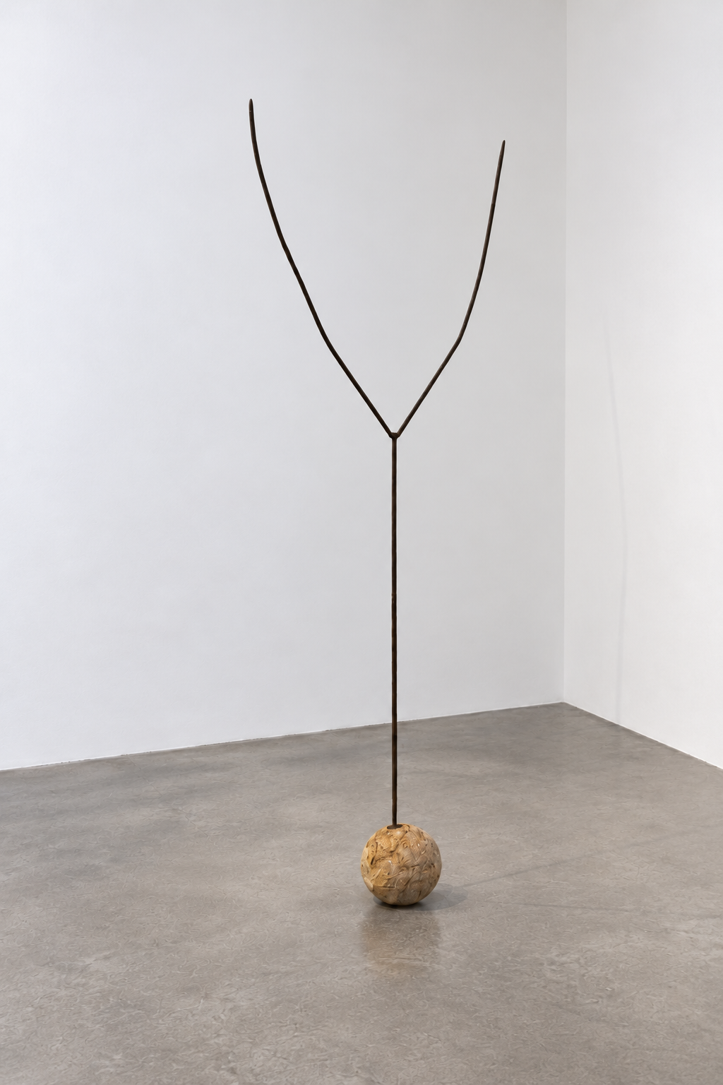 Y-shaped sculpture on an ochre concrete ball-1.png