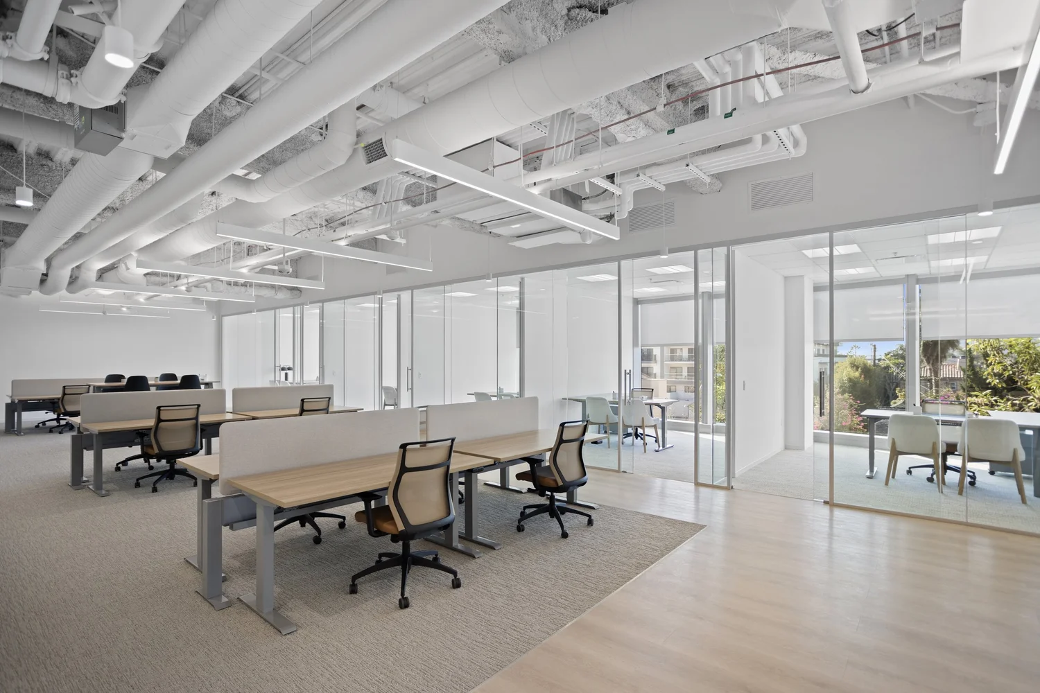 Open workstations and collaboration space furnished by Source COI