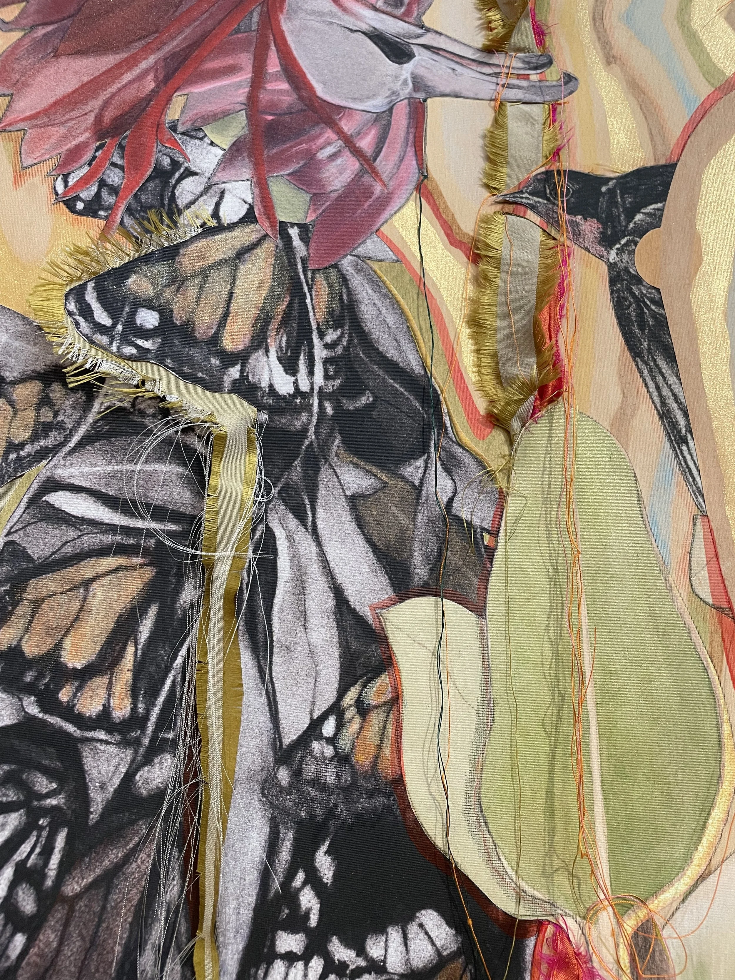 Close-up detail of embroidered thread, silk fabric and Monarch butterflies.