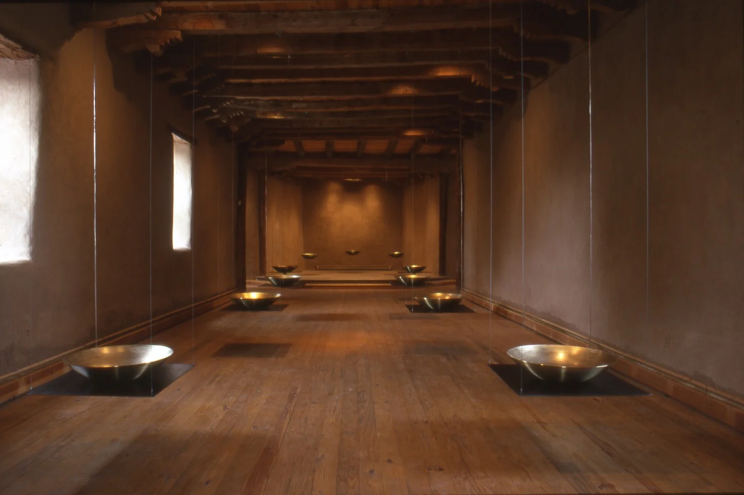 Alchemy (2000). Old San Ysidro Church, Corrales, NM (Sep. 22 - Oct. 1, 2000). Collaboration with visual artist Christine Wallers. Spun brass, steel, 20 channels of audio. This work was originally conceived as a site-specific installation for this space, but has been shown in other venues. (photo: Margot Geist)