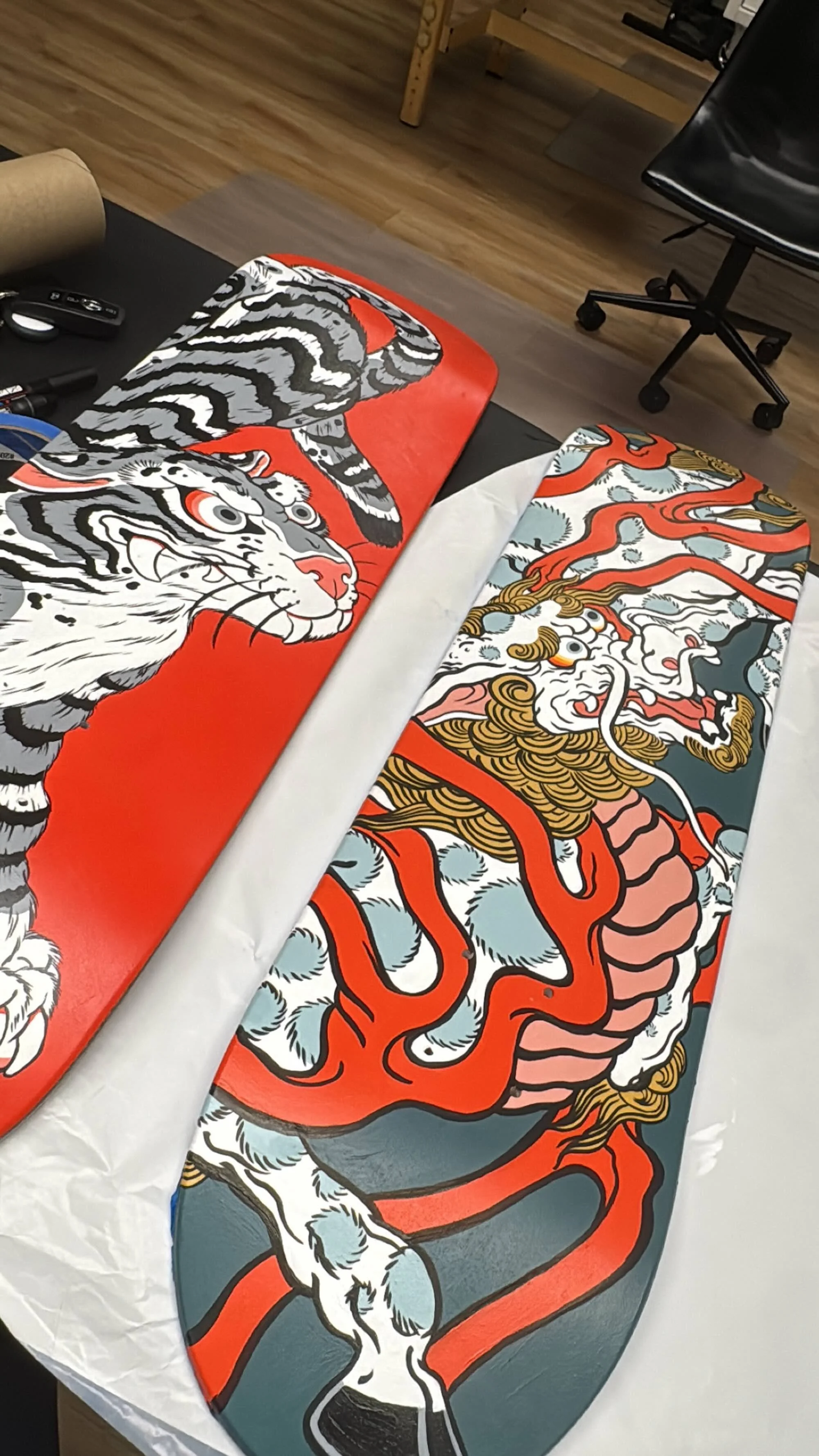 Kirin and Tiger, hand painted skateboards by Cindy Maxwell.2.jpeg