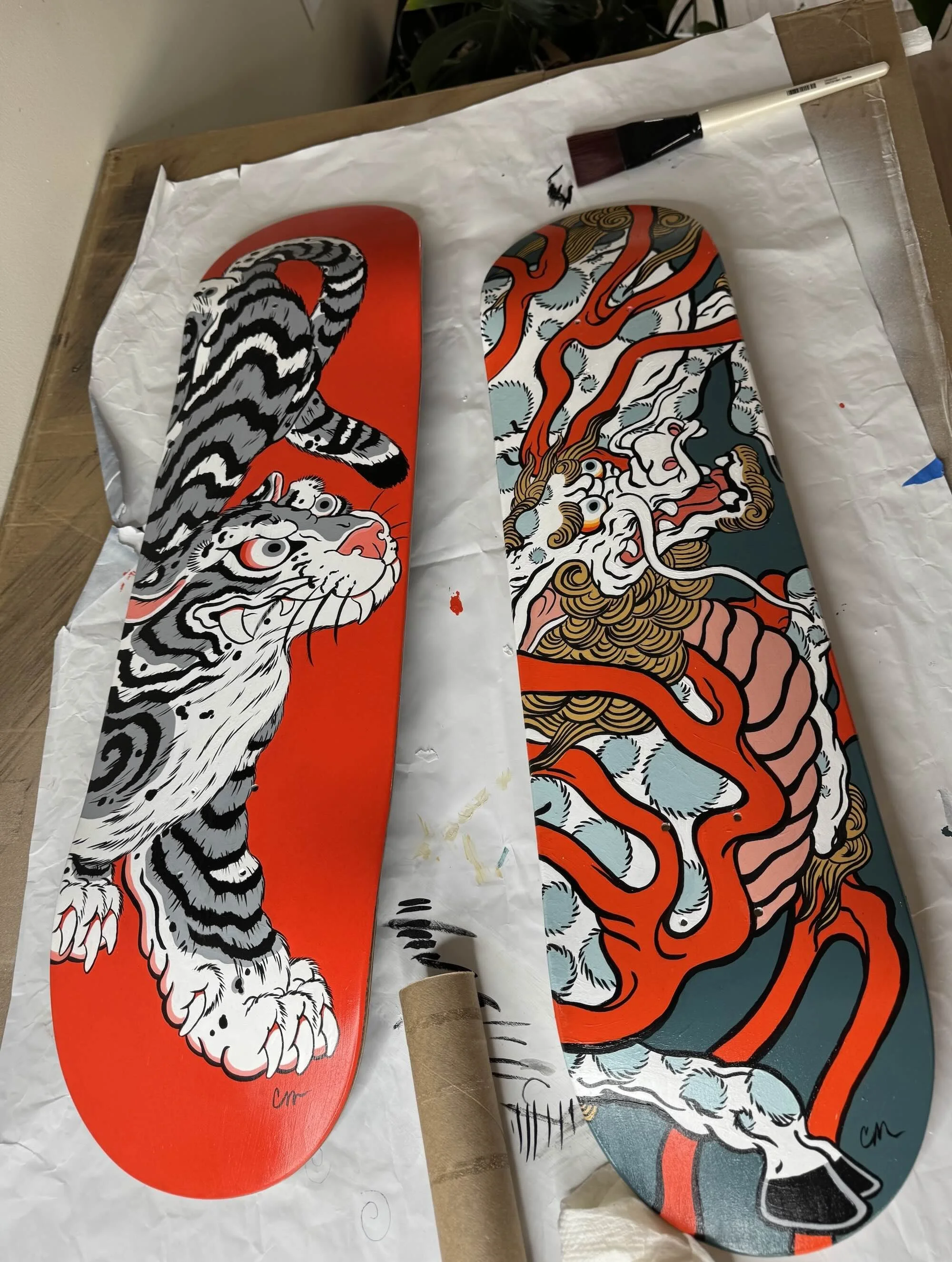 Kirin and Tiger, hand painted skateboards by Cindy Maxwell.1.jpeg