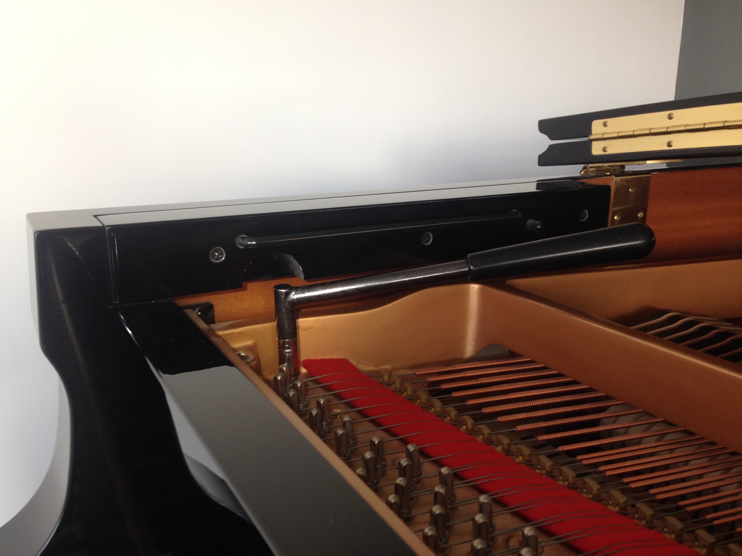 The Utility fits easily under the music desk guide of this Yamaha grand...