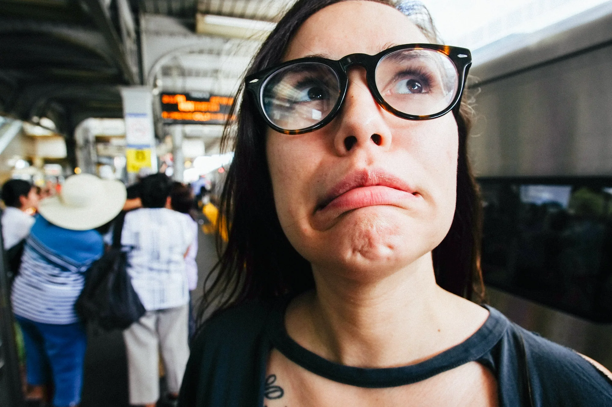 Alisa waiting for a train. Fuji Xpro-1, Rokinon 12mm f/2.