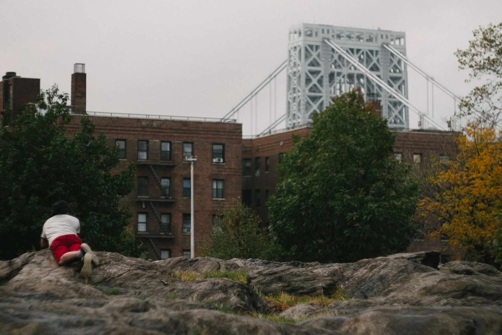 A man lying on a wet rock. Fuji X-pro1,Helios 44-4.