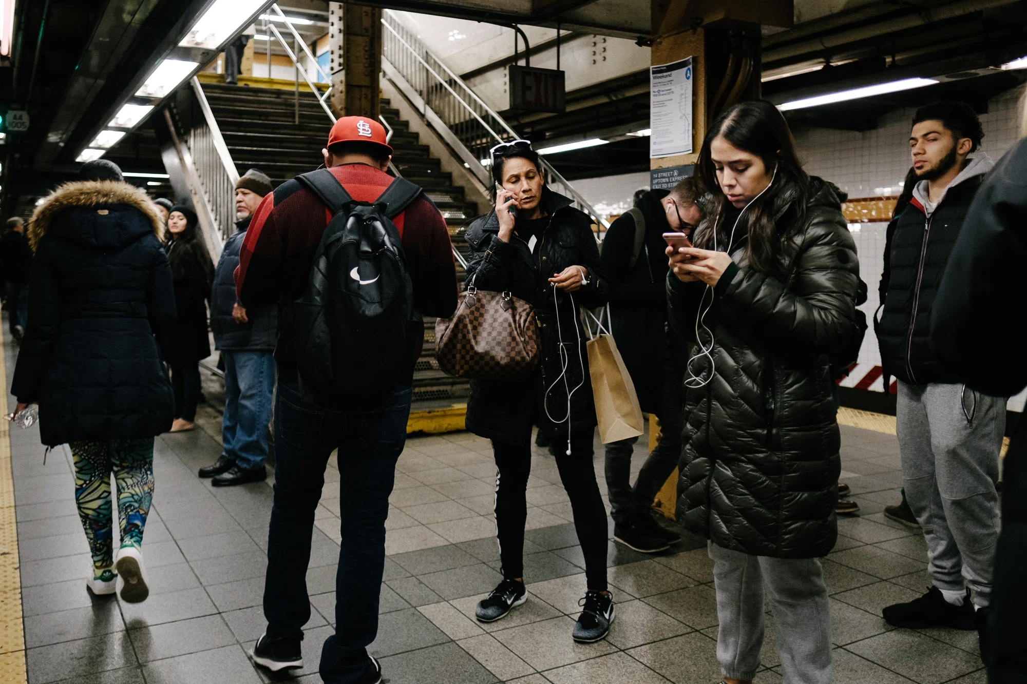 A woman in the 14th street ACE station in Chelsea, Manhattan. Fuji X-pro2, Fuji XF 16mm f/1.4 WR.