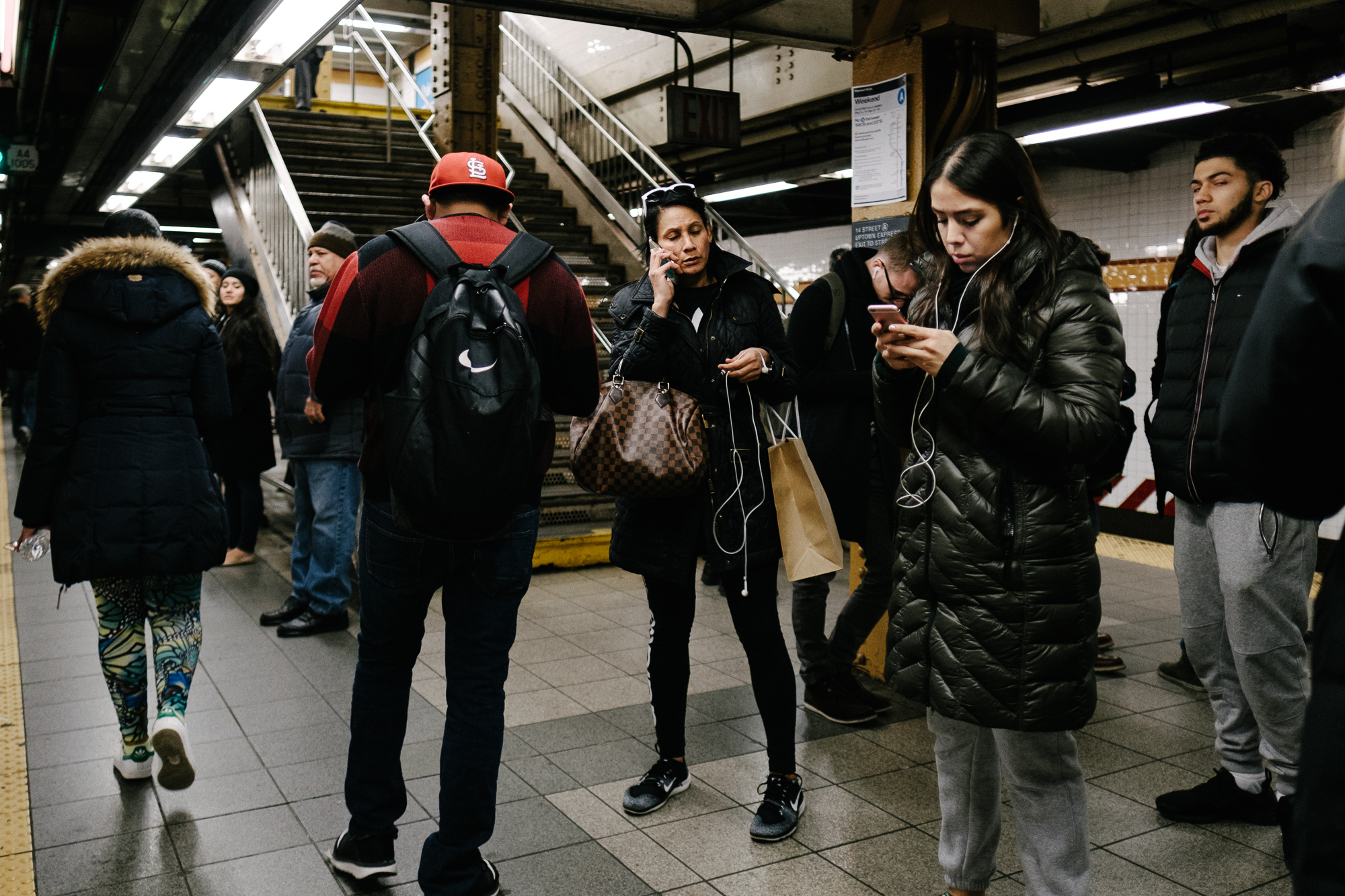 A woman in the 14th street ACE station in Chelsea, Manhattan. Fuji X-pro2, Fuji XF 16mm f/1.4 WR.