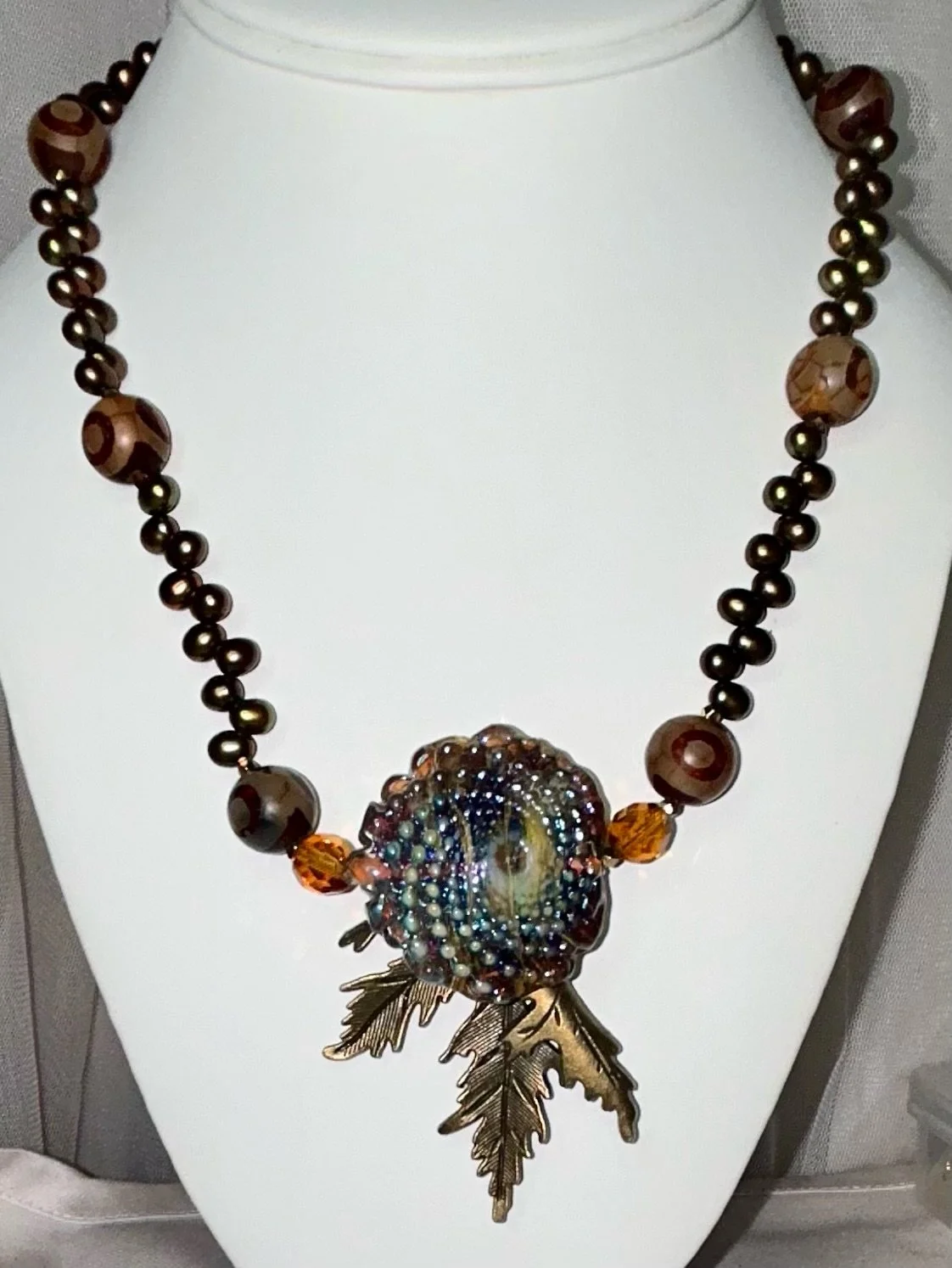 Large handmade multicolor glass spiral with brass leaf, freshwater Biwa pearls, and 10 mm painted agate round beads.