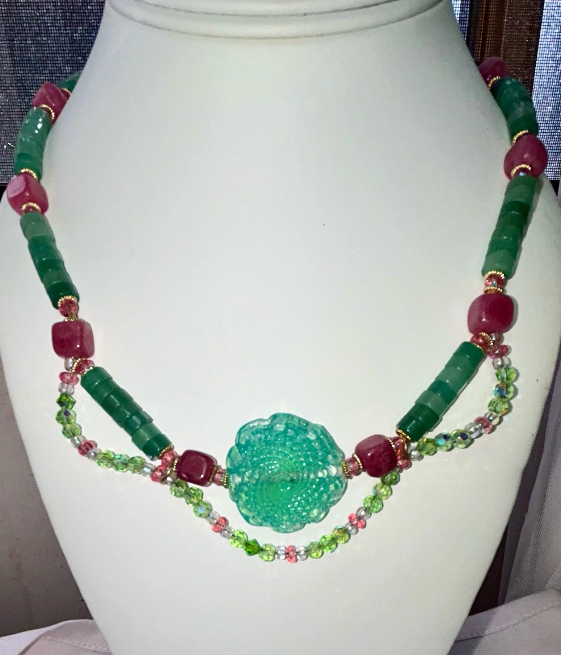 Green handmade center spiral with adventurine heishi and strawberry quartz cubes.