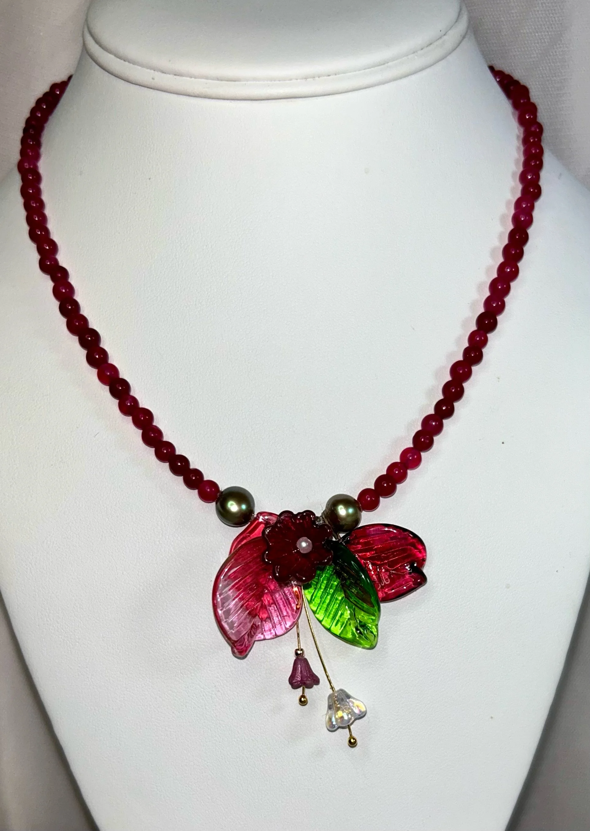 Raspberry dyed 4 mm agate stone  with hand made glass flower and leaves. Natural green freshwater pearls. 