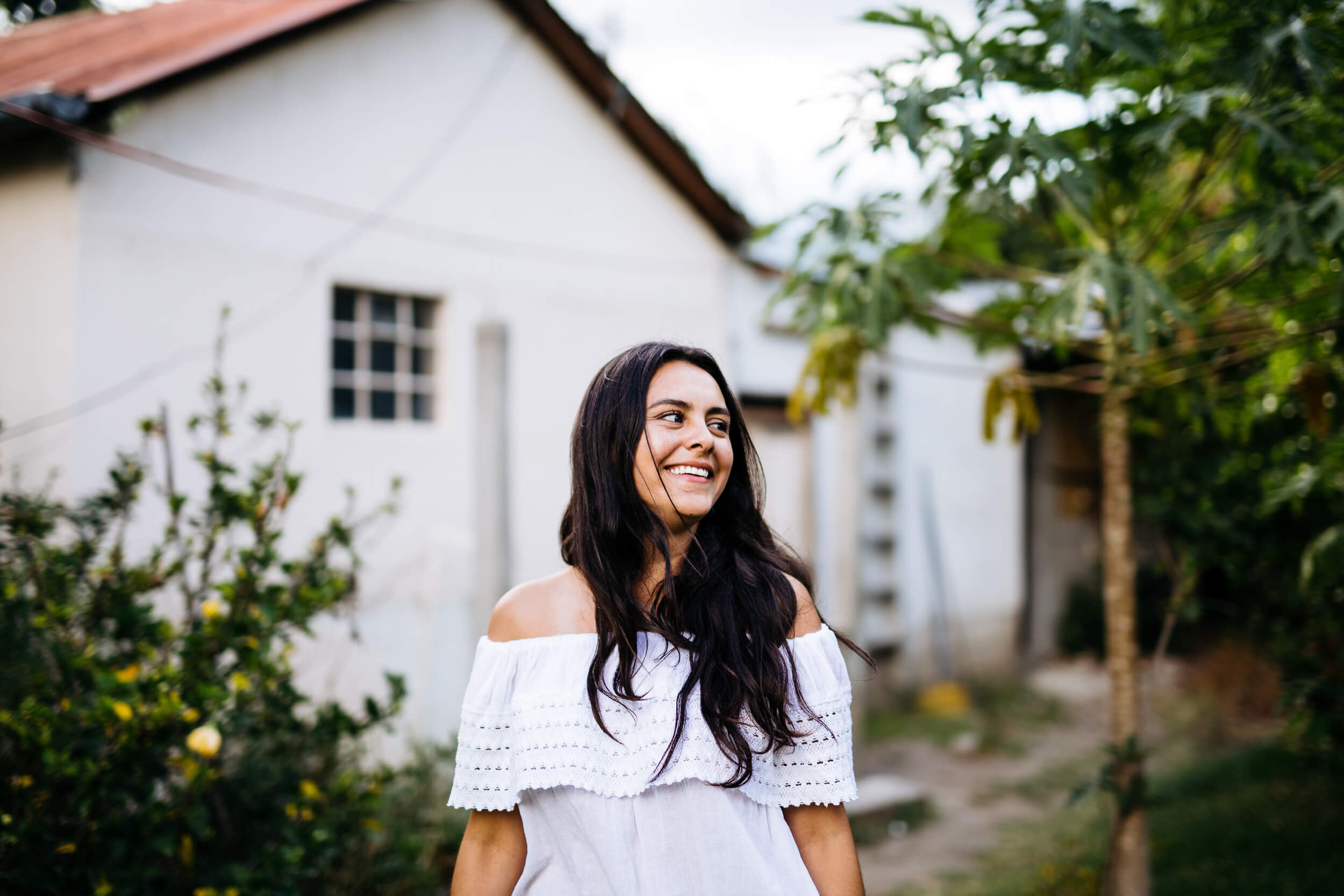 Portrait female model rustic white building
