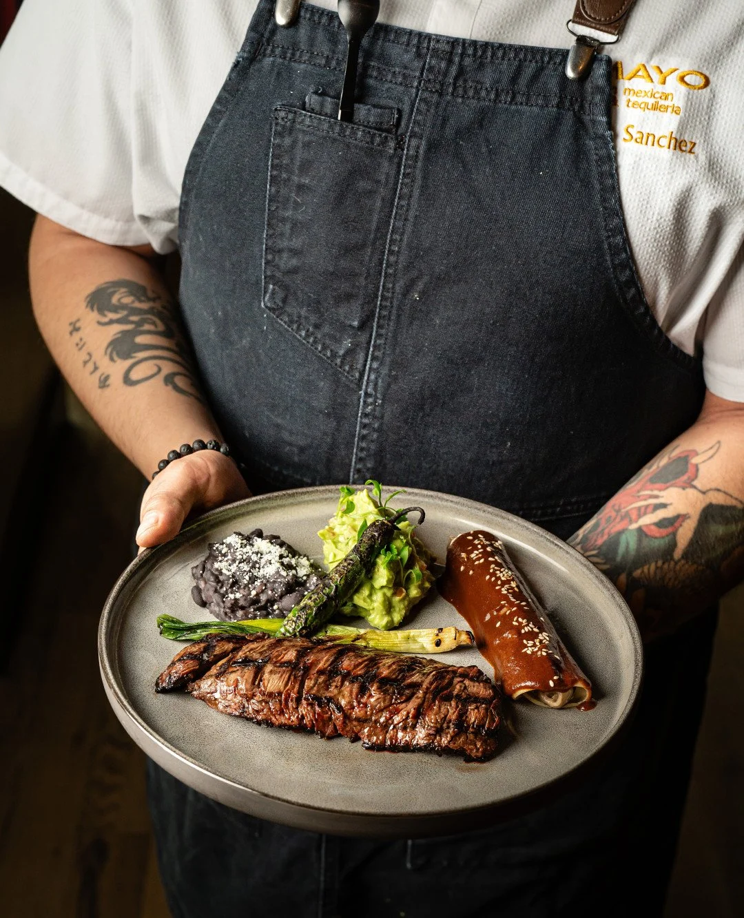 Your new favorite Mexican dish is here. Our Tampique&ntilde;a brings together carne asada-style steak, rich mole enchilada, guacamole, and all the right sides for a true taste of tradition with a modern twist. 🇲🇽✨