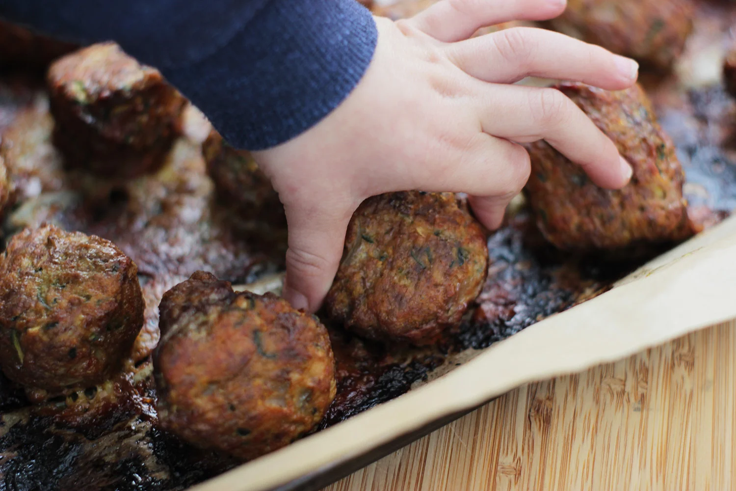 hand grabbing meatball.jpg
