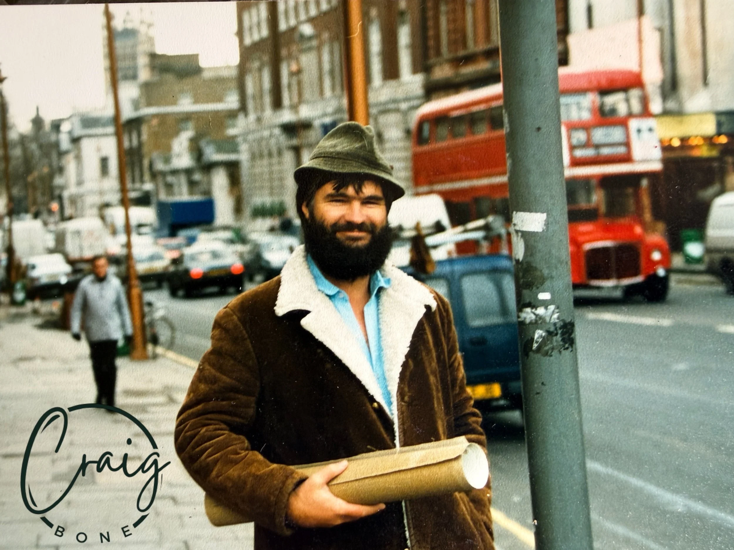 London, 1980s. Craig on the street with his trilby, shearing coat, and a fresh roll of paintings under his arm. This was usually the start of a proper adventure&mdash;first down to Guildford to talk shop with his gallery friend Peter and catch up wit