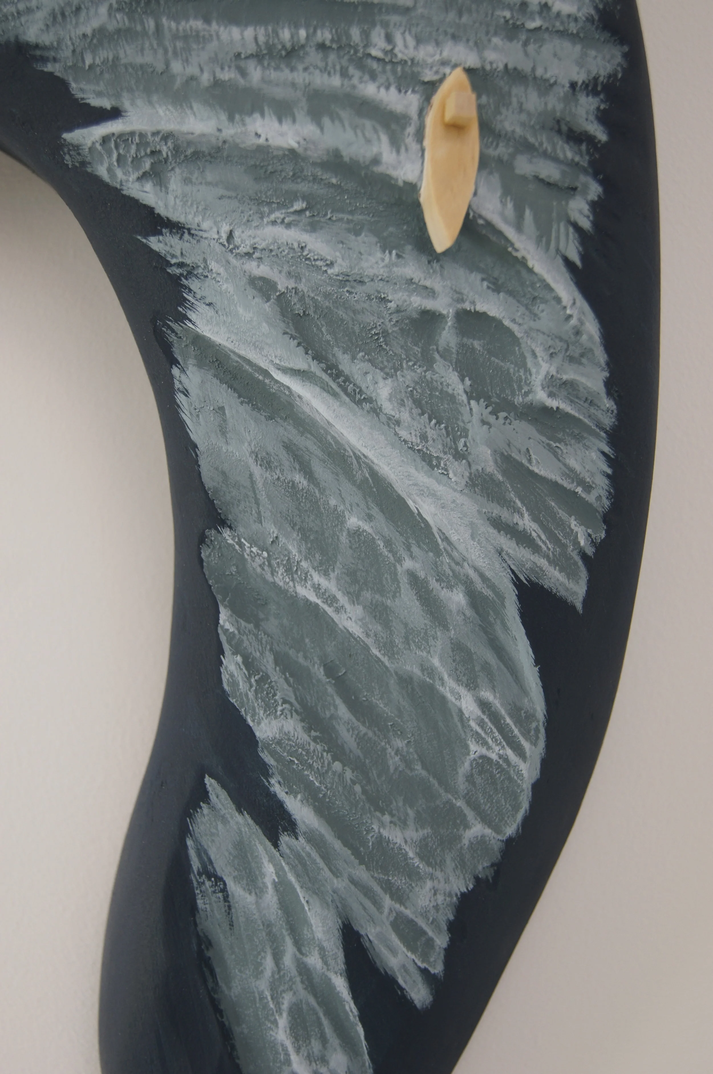 boat and sea surface are sculpted wood