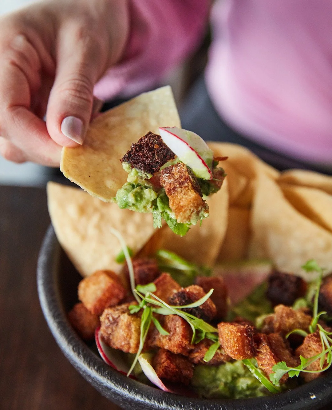 Crispy pork belly chicharr&oacute;n meets creamy guac, tangy cotija &amp; a kick of pickled chili. Every bite, your way.